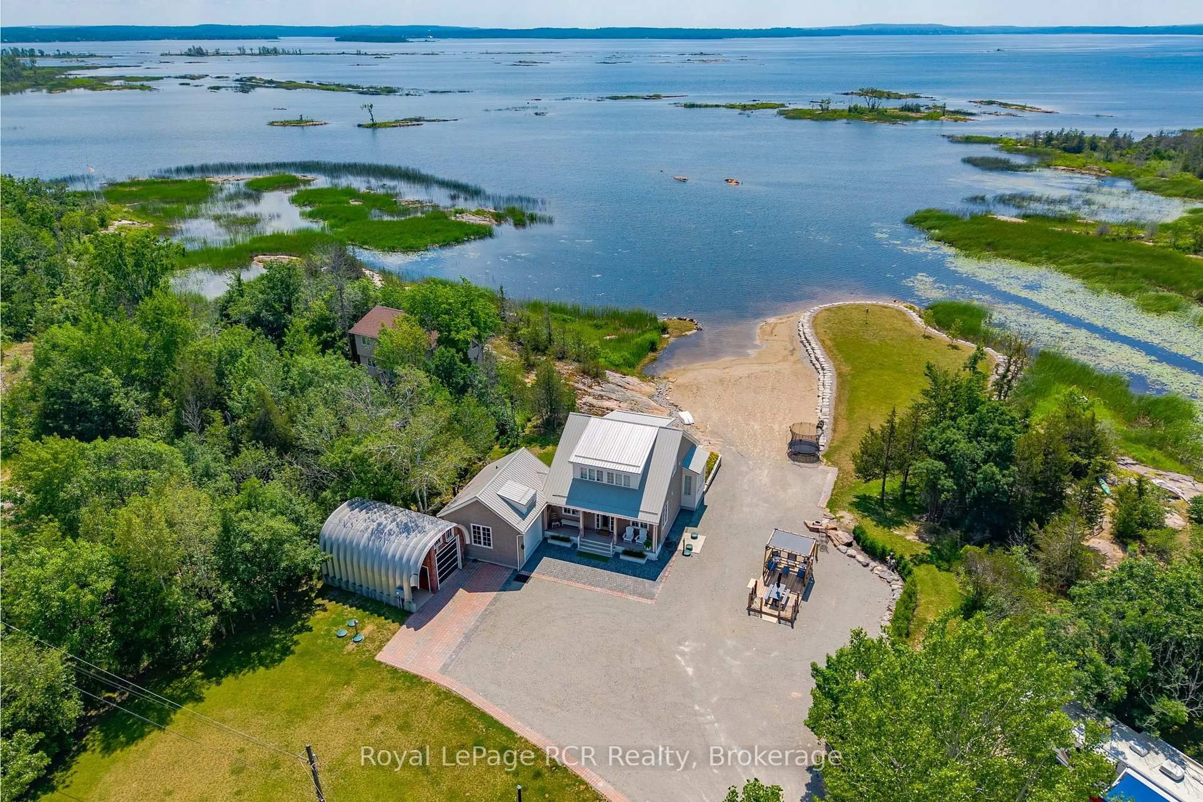A pic from outside/outdoor area/front of a property/back of a property/a pic from drone, water/lake/river/ocean view for 101 Evergreen Lane, Georgian Bay Ontario L0K 1S0