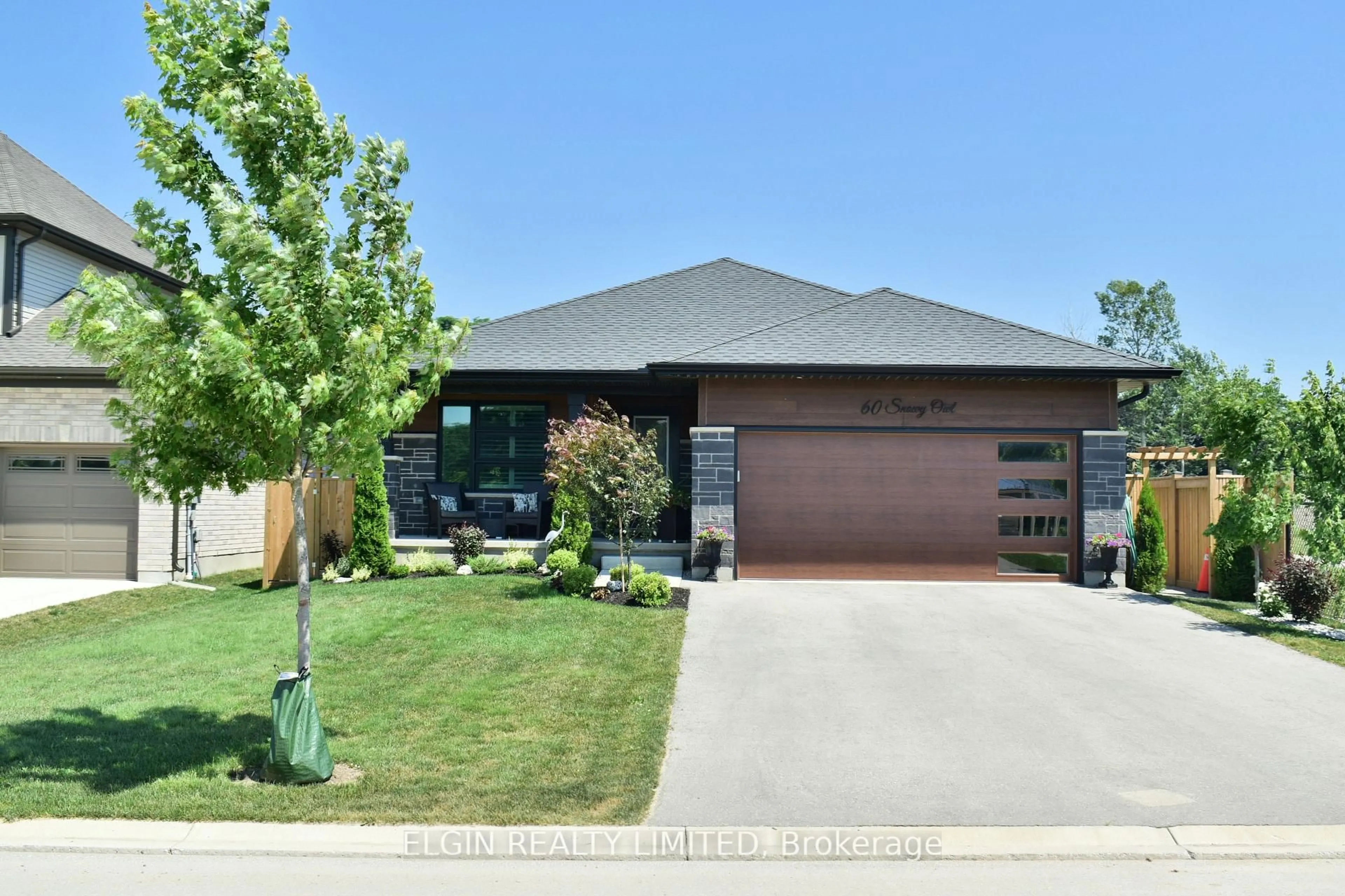 Home with brick exterior material, street for 60 Snowy Owl Tr, Central Elgin Ontario N5R 0M7
