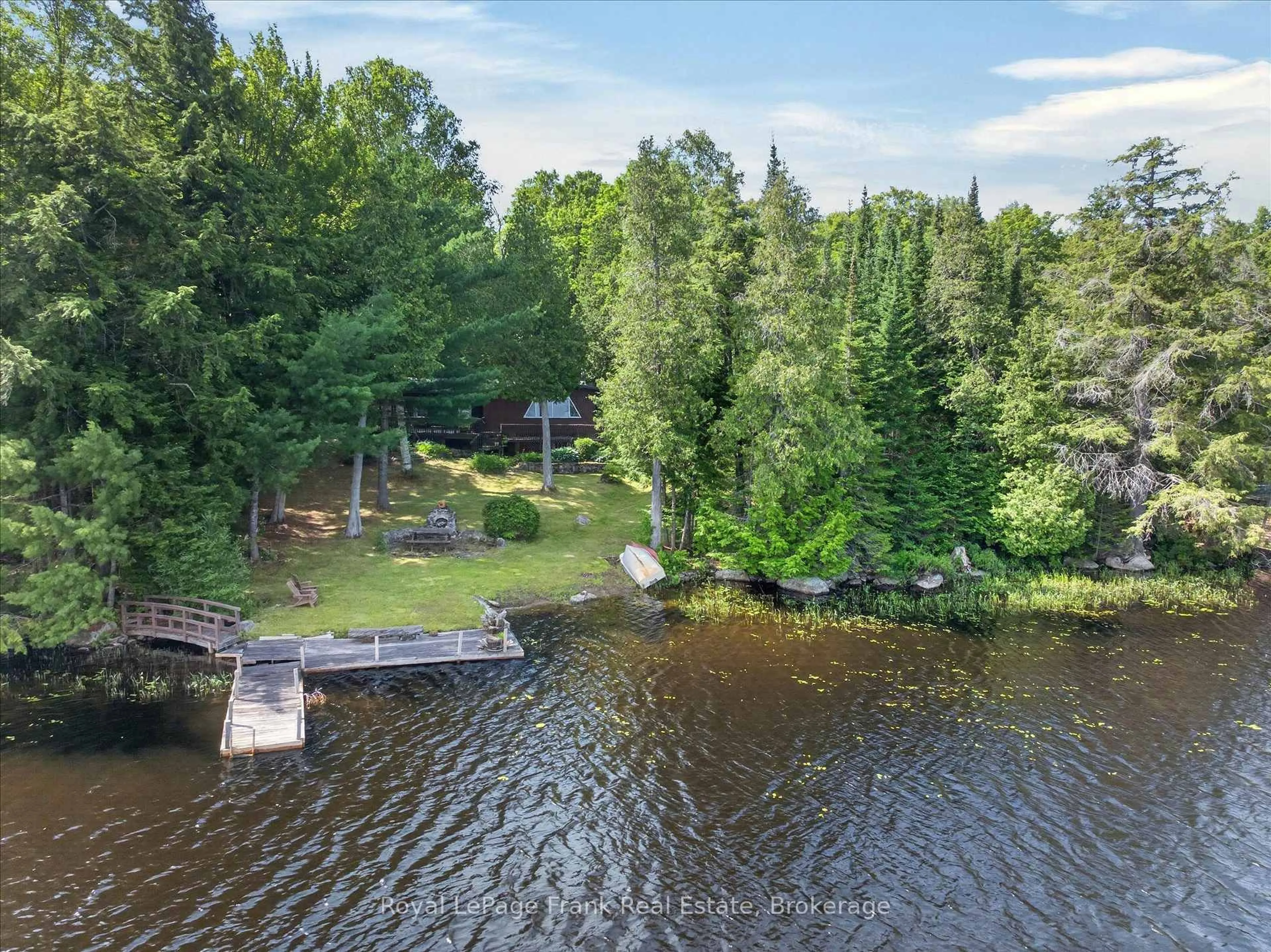 A pic from outside/outdoor area/front of a property/back of a property/a pic from drone, water/lake/river/ocean view for 1480 Topps Dr, Highlands East Ontario K0L 1M1