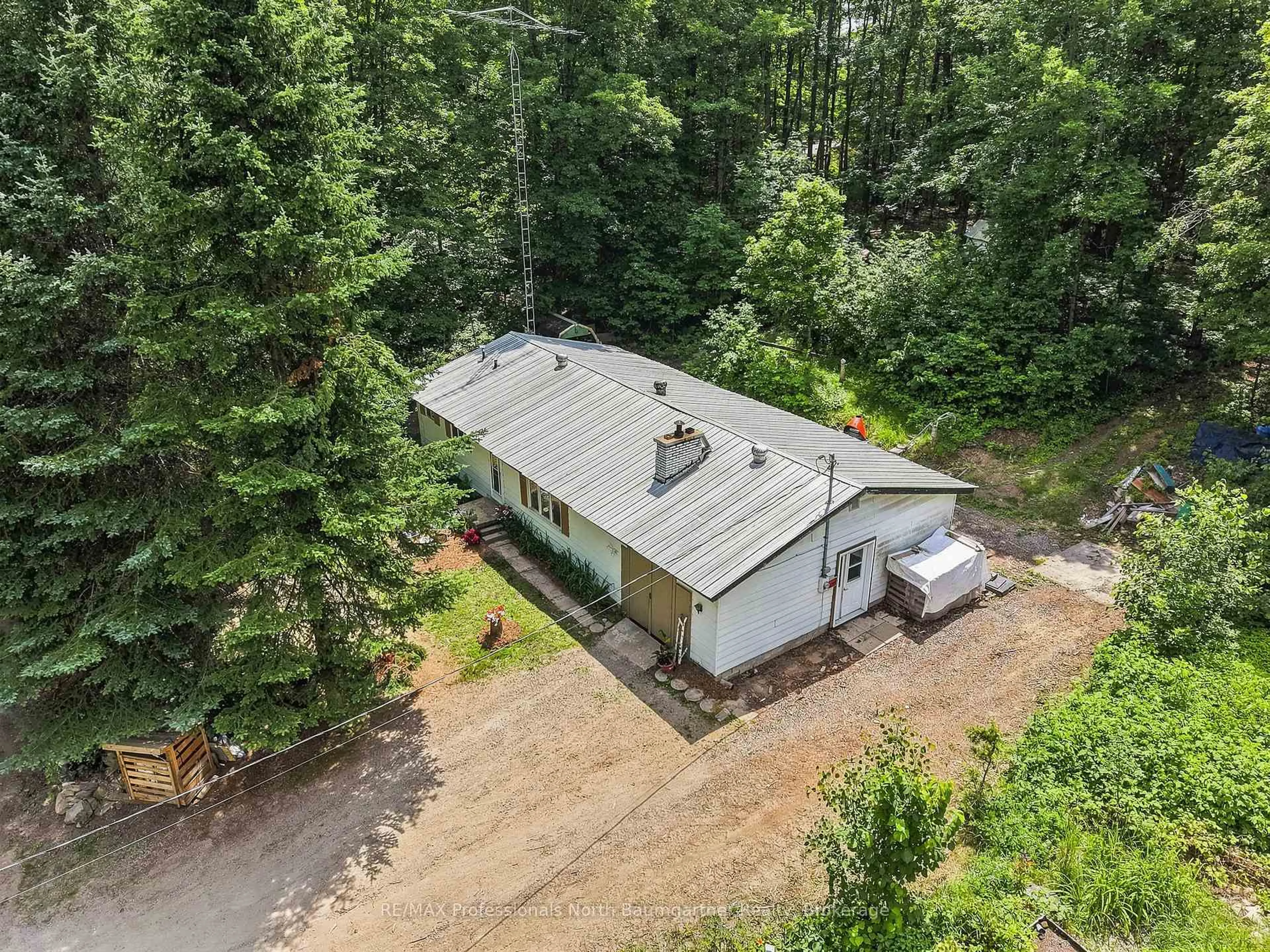 A pic from outside/outdoor area/front of a property/back of a property/a pic from drone, forest/trees view for 1201 Wenona Lake Rd, Dysart et al Ontario K0M 1S0