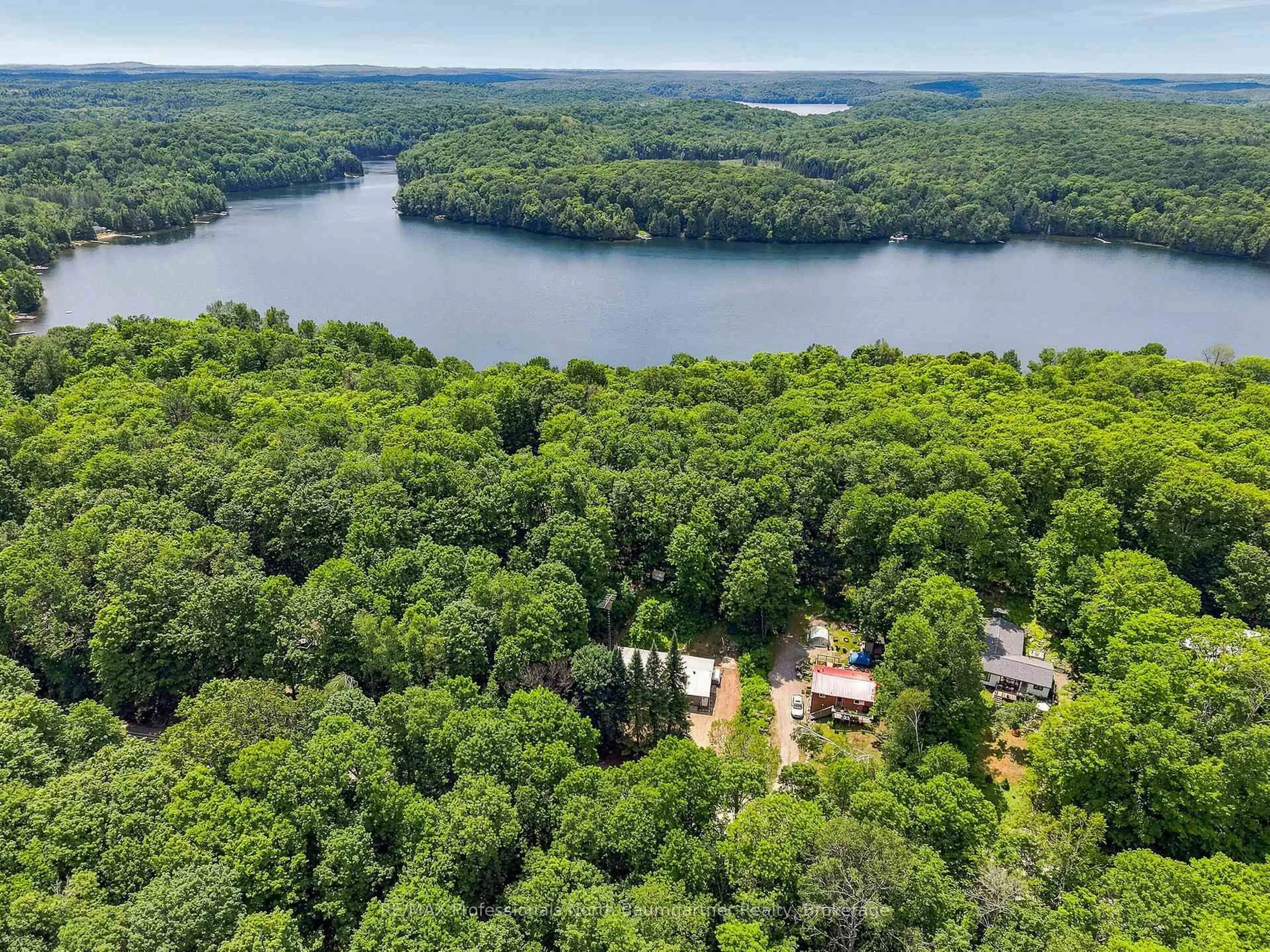 A pic from outside/outdoor area/front of a property/back of a property/a pic from drone, water/lake/river/ocean view for 1201 Wenona Lake Rd, Dysart et al Ontario K0M 1S0
