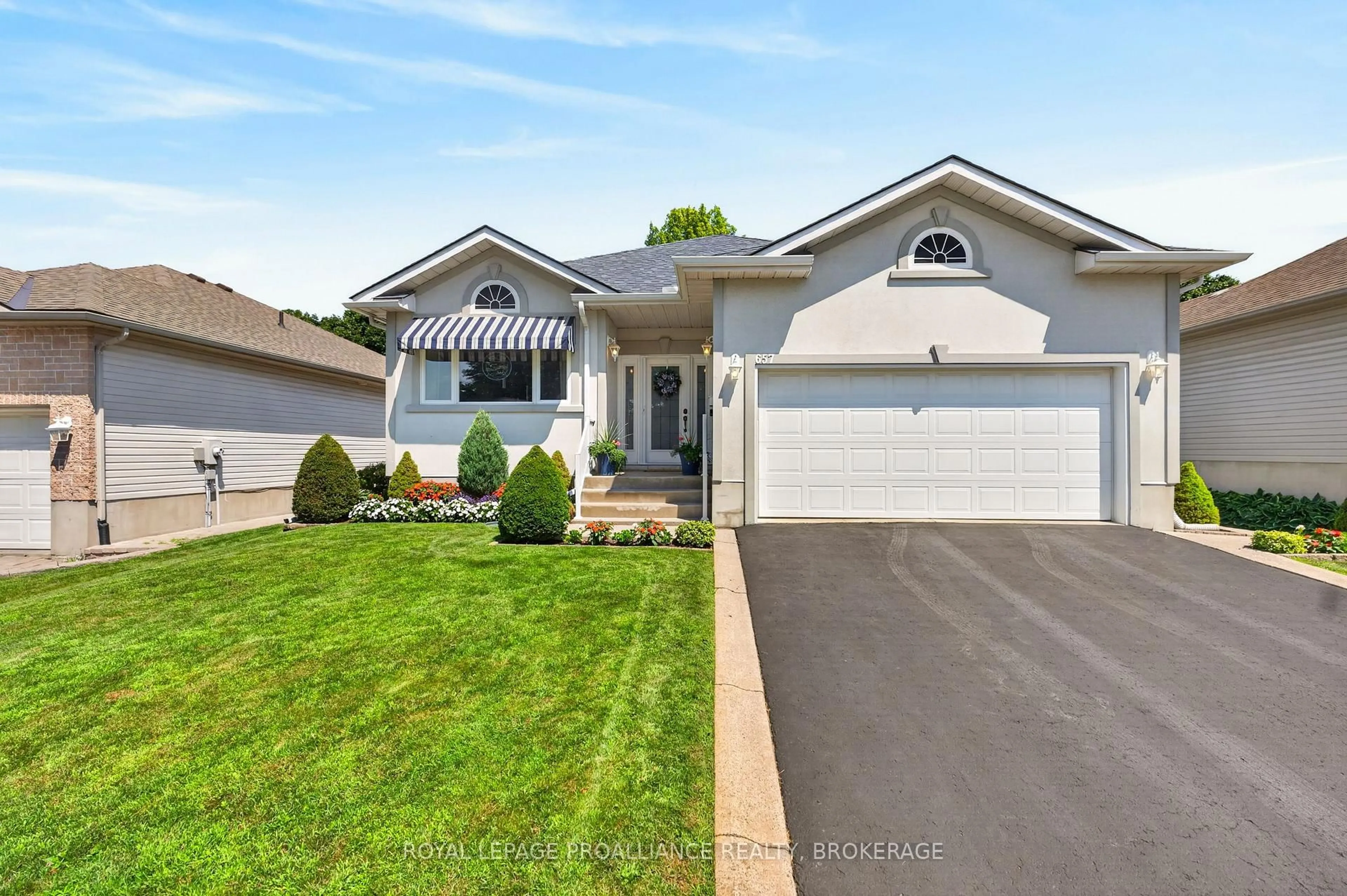 Home with vinyl exterior material, street for 657 Roosevelt Dr, Kingston Ontario K7M 8T8