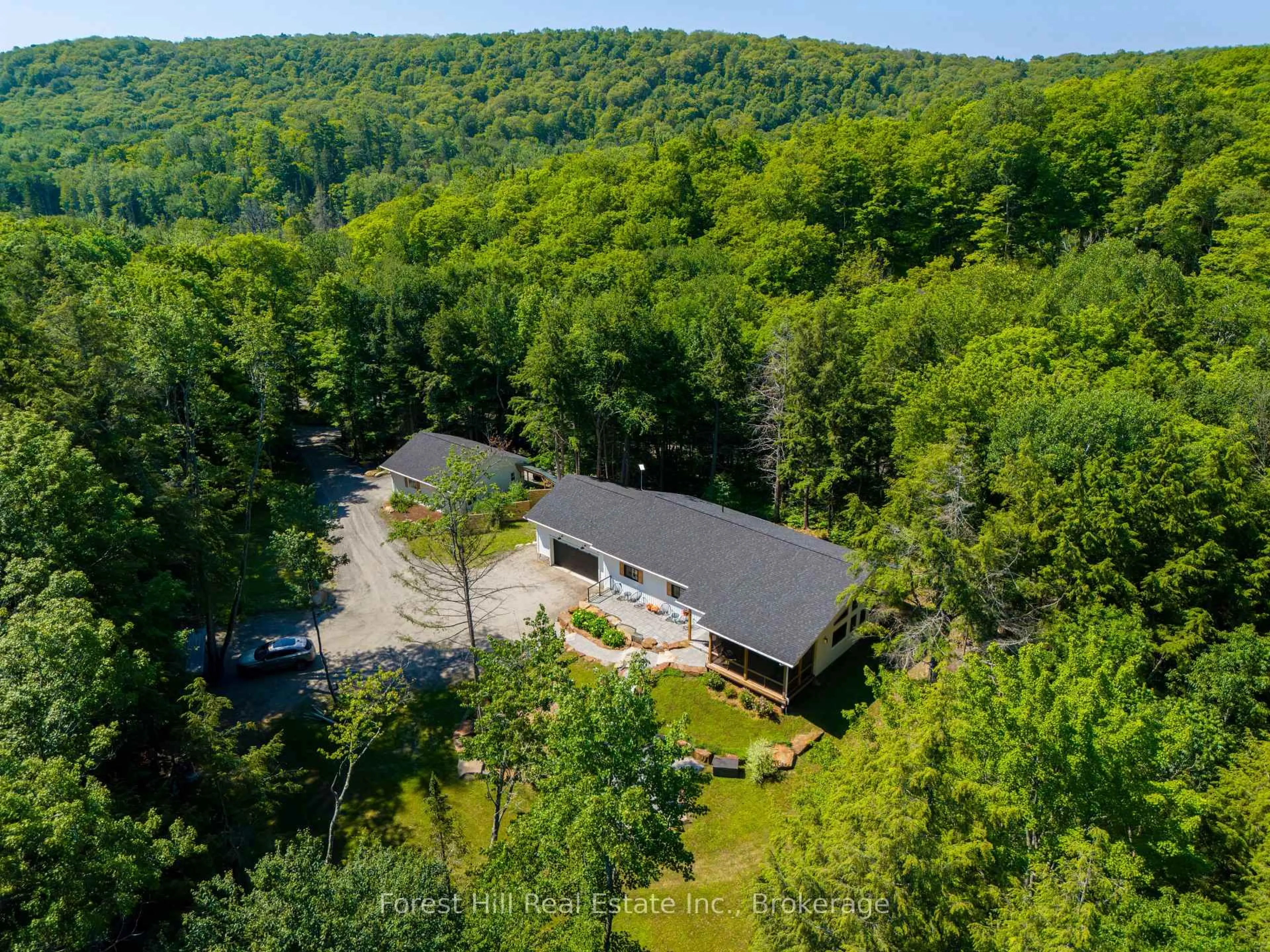 A pic from outside/outdoor area/front of a property/back of a property/a pic from drone, forest/trees view for 315 North Fox Lake Rd, Huntsville Ontario P1H 2J2