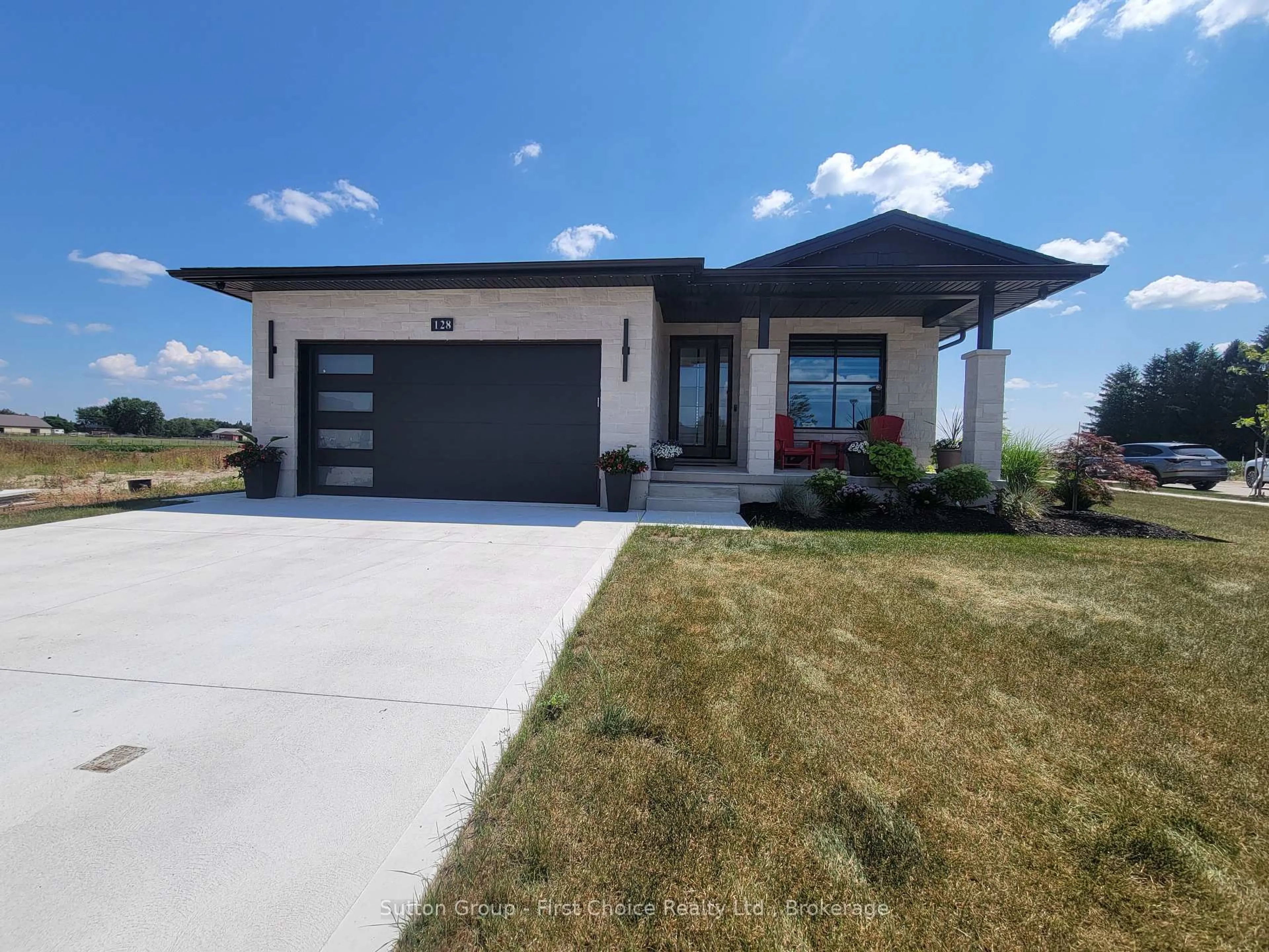 Home with brick exterior material, street for 128 Rowe Ave, South Huron Ontario N0M 1S1