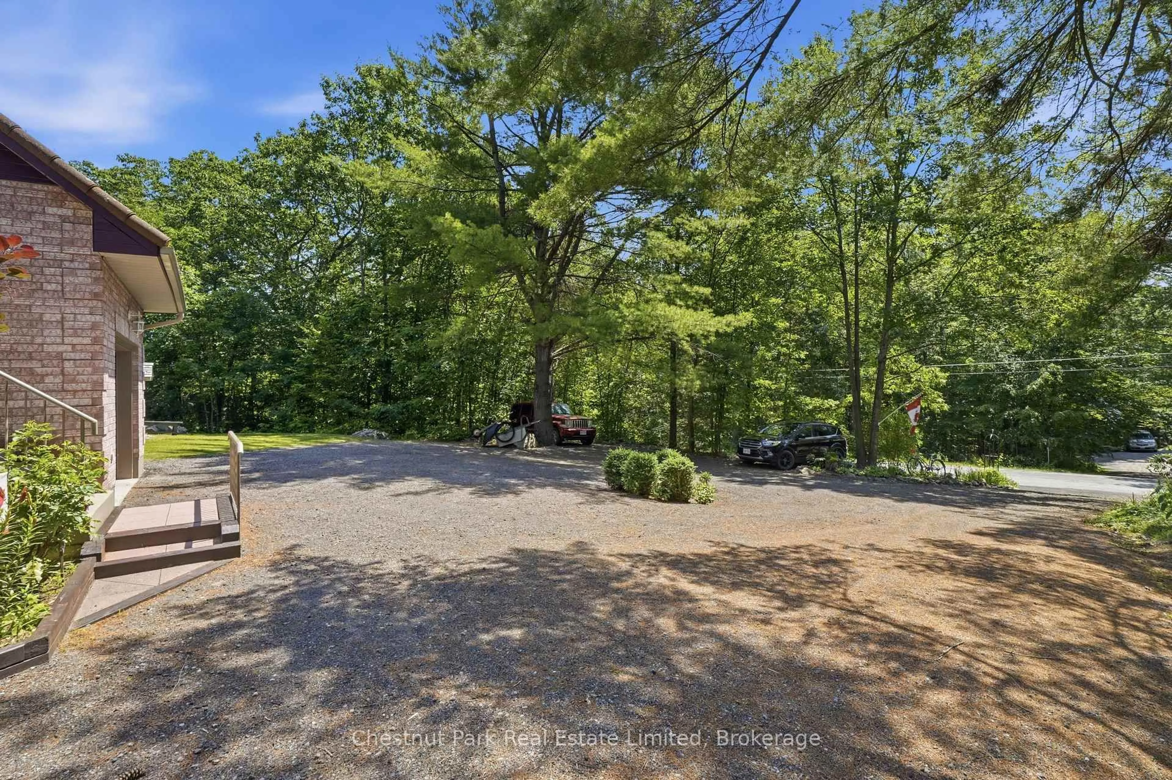 A pic from outside/outdoor area/front of a property/back of a property/a pic from drone, forest/trees view for 72 Kenner Crt, Tweed Ontario K0K 3J0