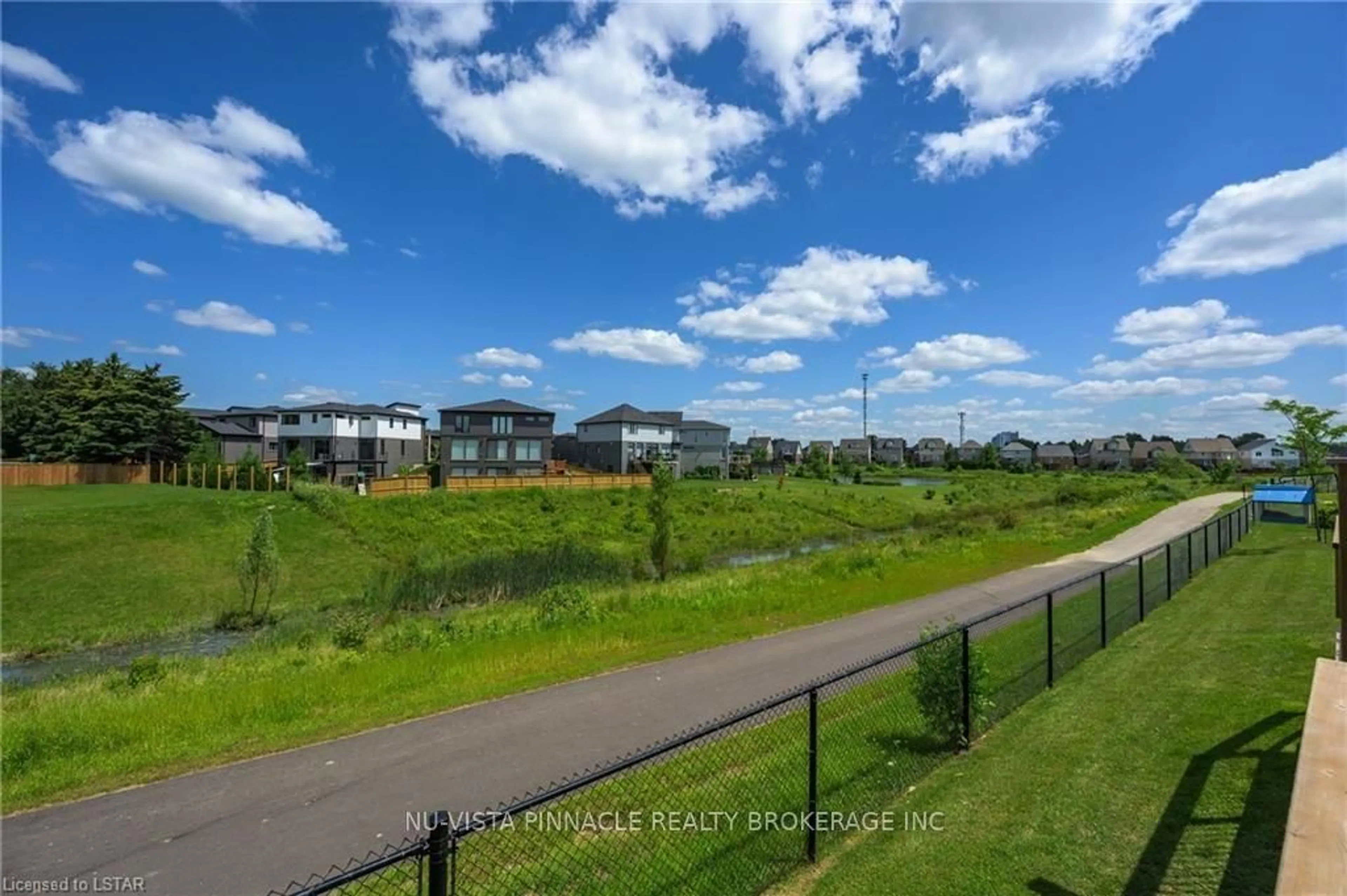 A pic from outside/outdoor area/front of a property/back of a property/a pic from drone, water/lake/river/ocean view for 2491 Tokala Tr #3, London North Ontario N6G 0X1