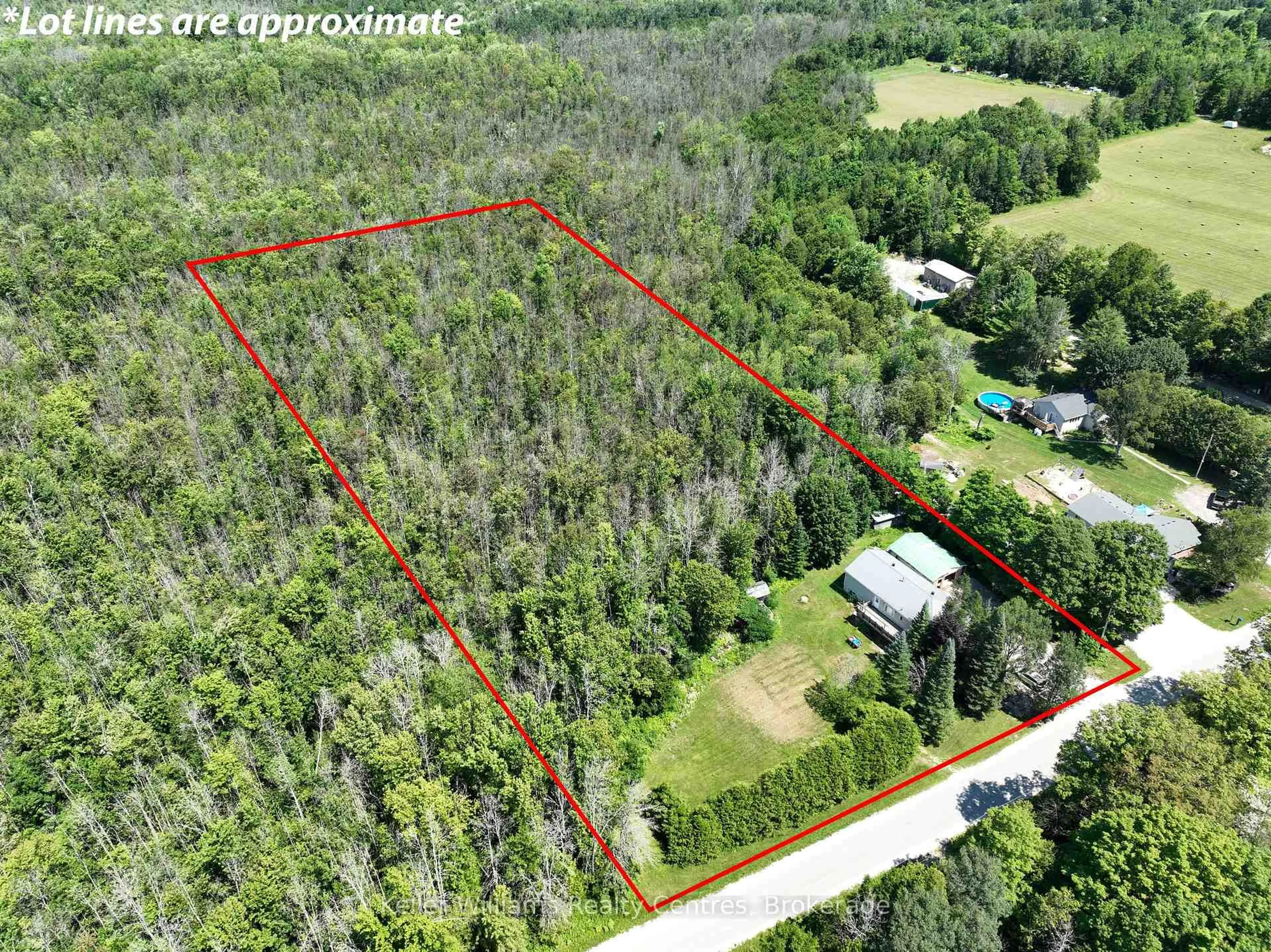 A pic from outside/outdoor area/front of a property/back of a property/a pic from drone, forest/trees view for 242161 Concession 3 RR1, Georgian Bluffs Ontario N4K 5N7