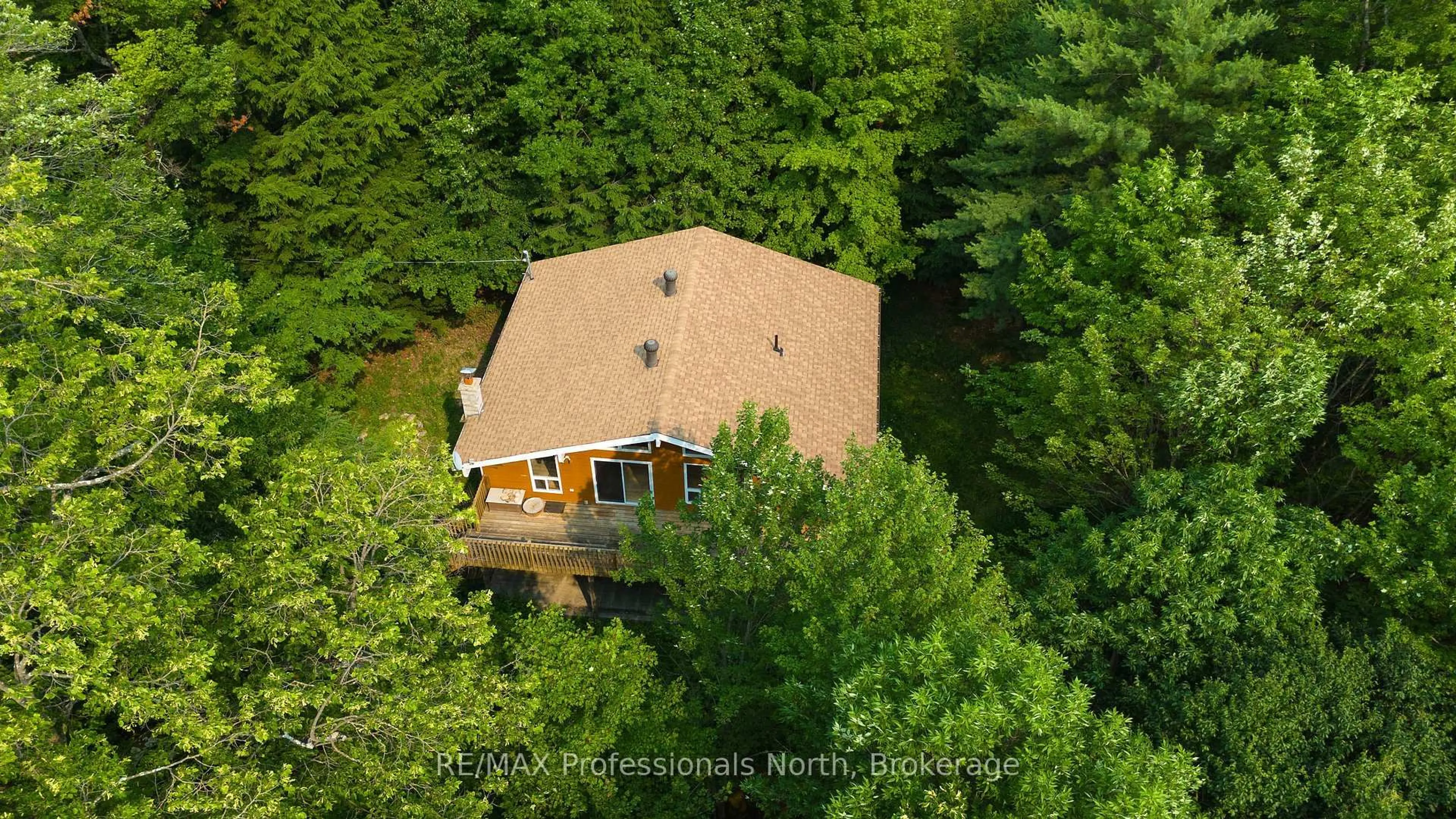 A pic from outside/outdoor area/front of a property/back of a property/a pic from drone, forest/trees view for 13 Hickory Cres, Seguin Ontario P0C 1J0