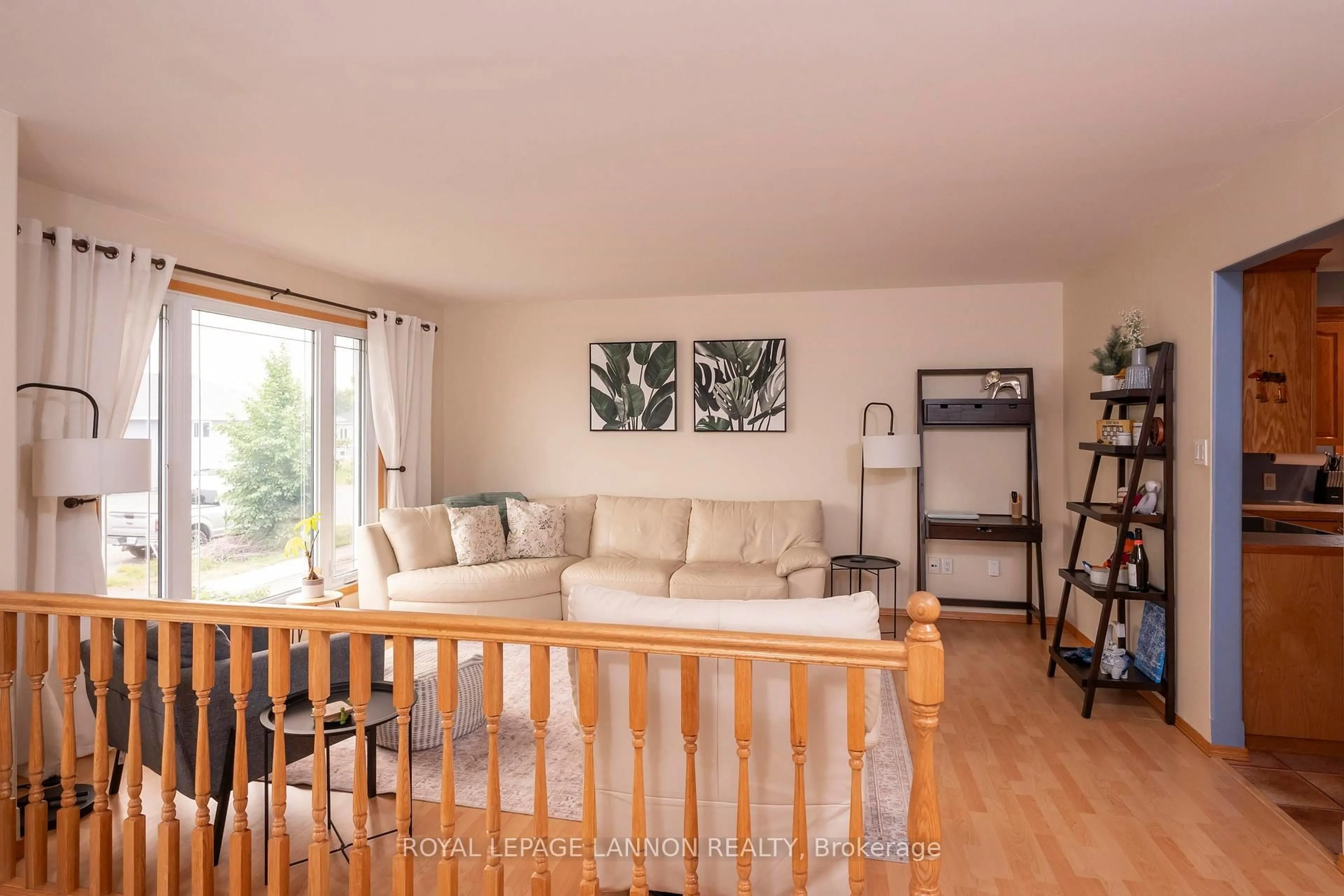 Living room with furniture, wood/laminate floor for 1486 Hutton Park Dr, Thunder Bay Ontario P7G 1E5