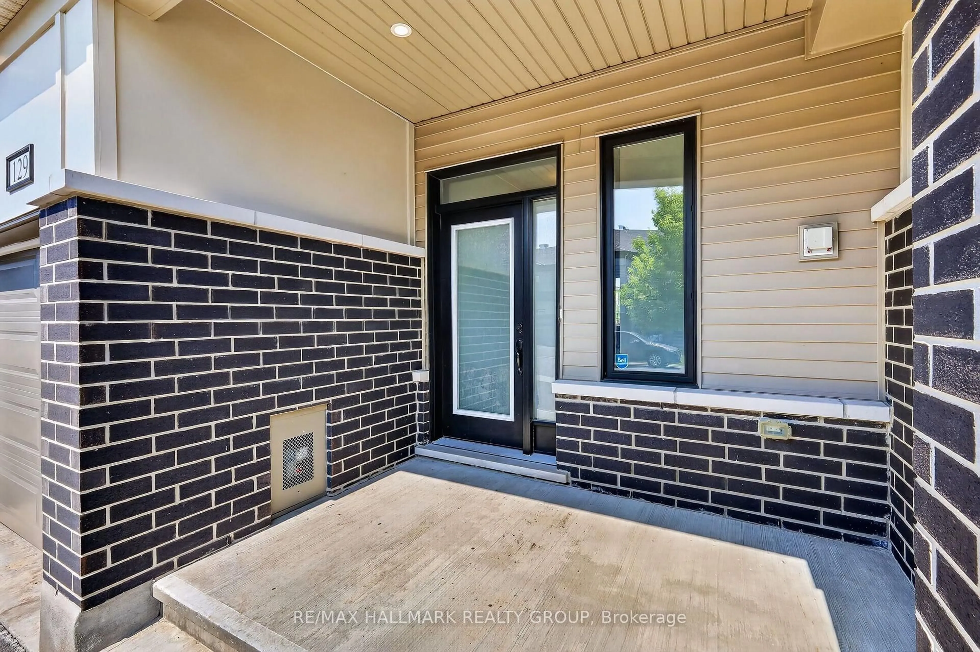 Home with brick exterior material, street for 129 Umbra Pl, Ottawa Ontario K2J 6N7