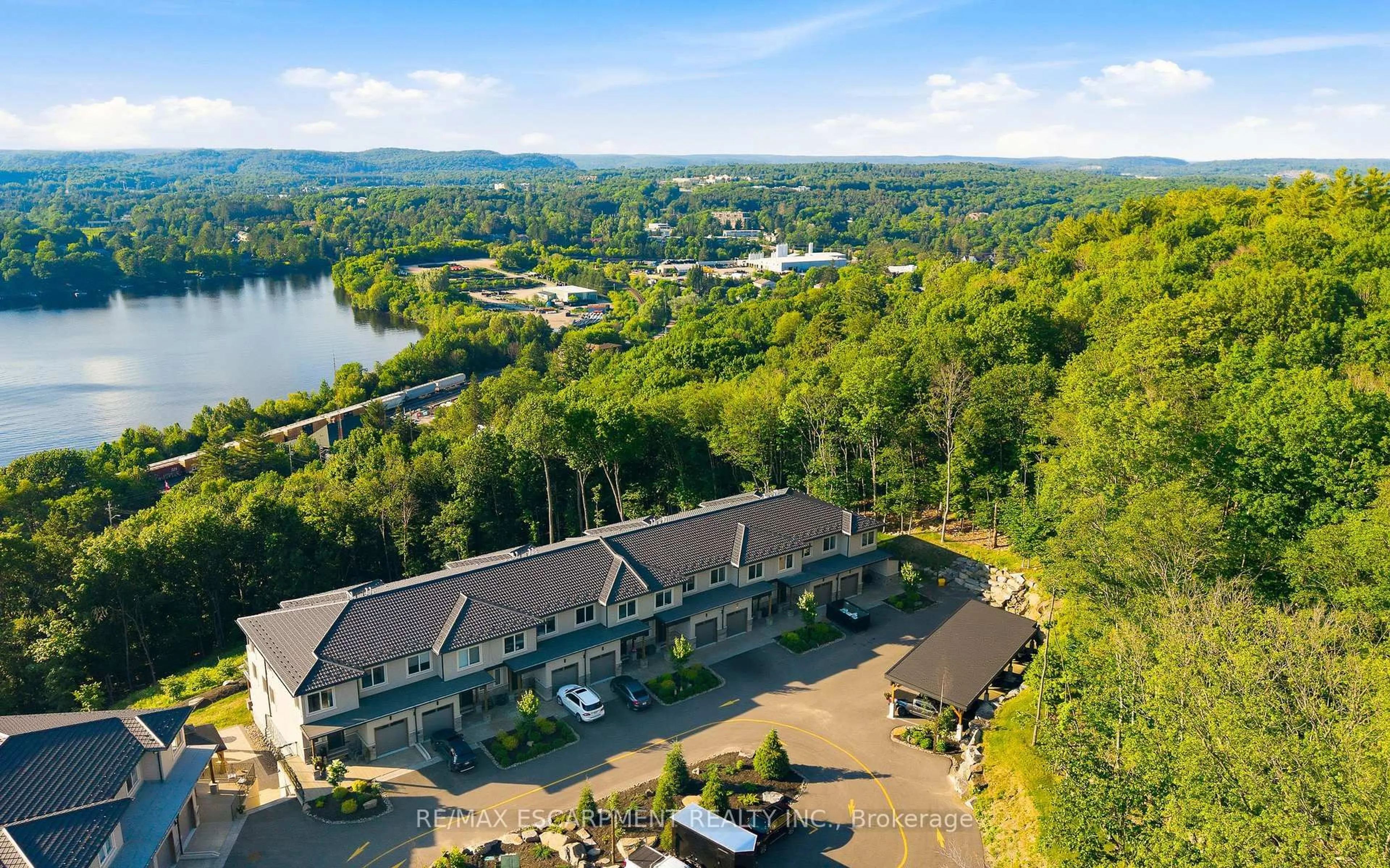 A pic from outside/outdoor area/front of a property/back of a property/a pic from drone, water/lake/river/ocean view for 33 Horizon Lane #2, Huntsville Ontario P1H 1V5