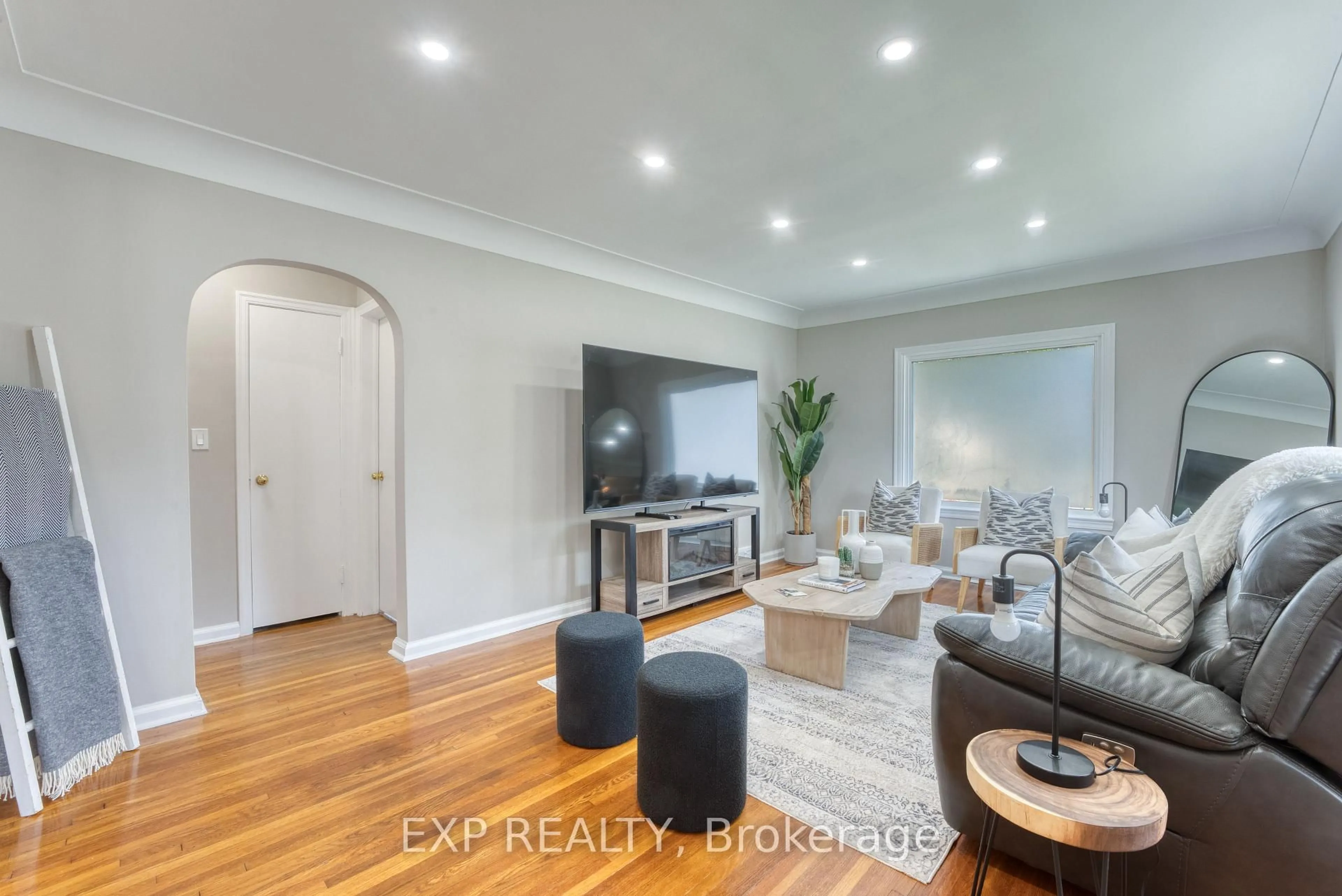 Living room with furniture, wood/laminate floor for 791 Scofield Ave, Windsor Ontario N9G 1L4