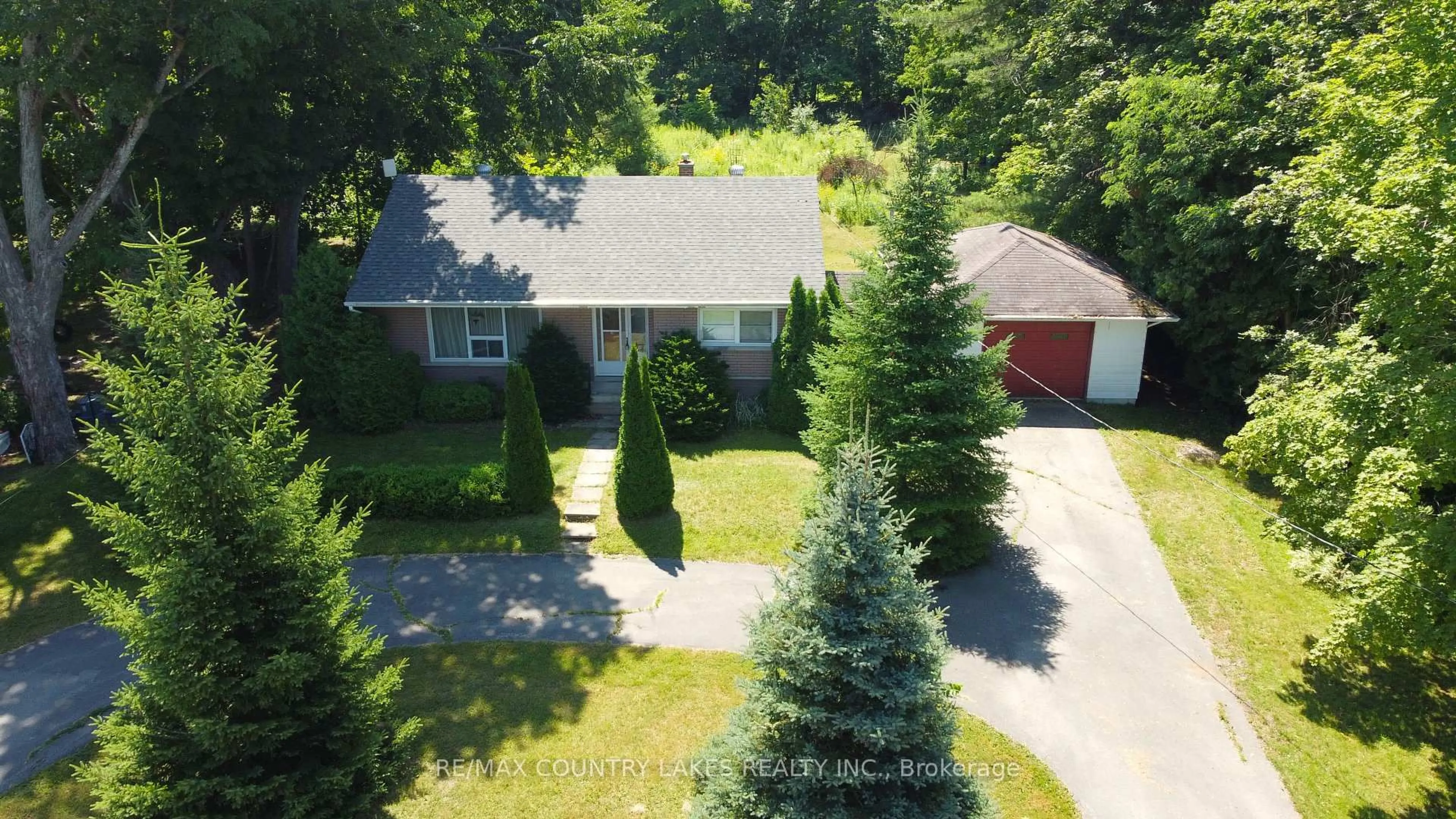 A pic from outside/outdoor area/front of a property/back of a property/a pic from drone, street for 986 Portage Rd, Kawartha Lakes Ontario K0M 2B0