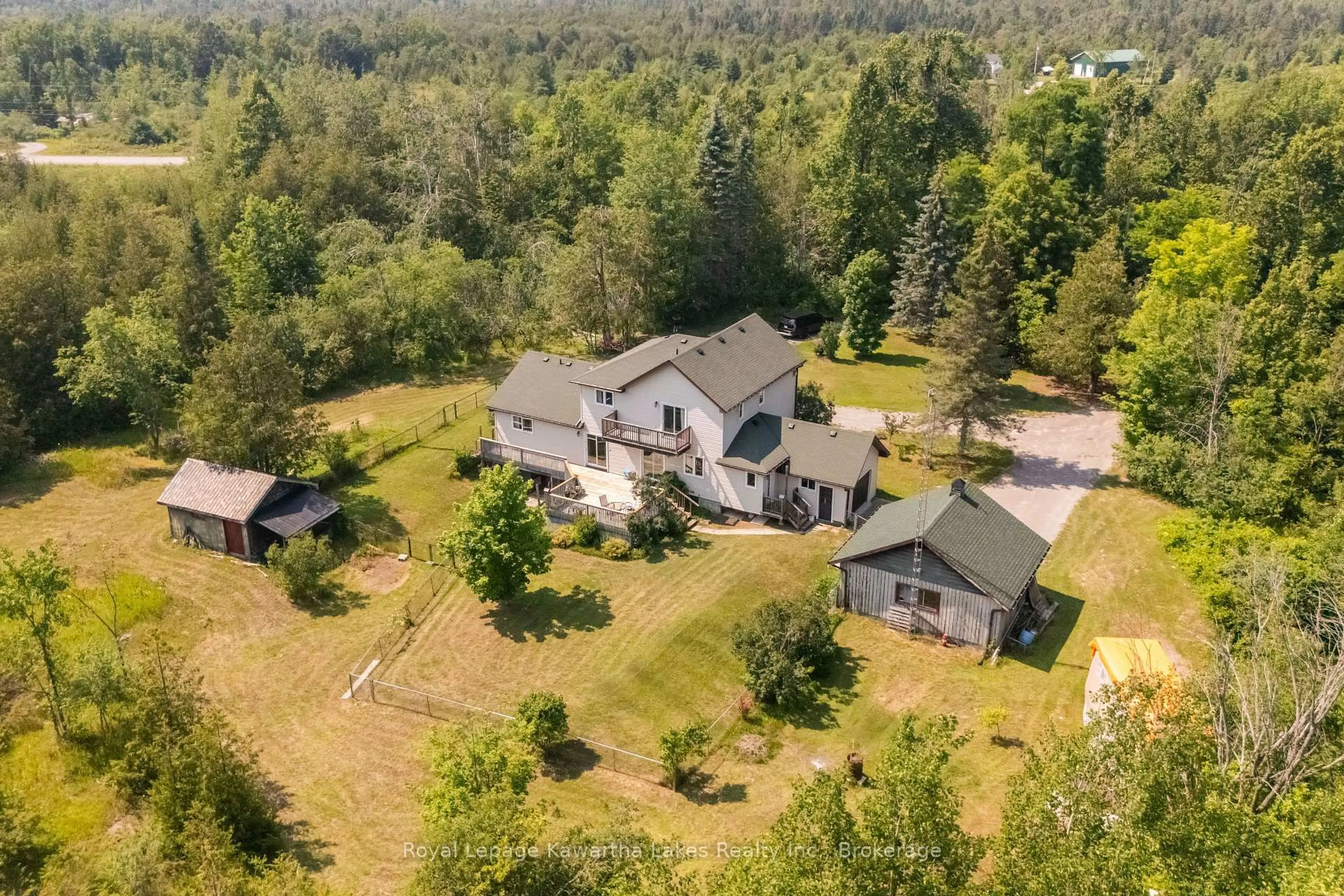A pic from outside/outdoor area/front of a property/back of a property/a pic from drone, forest/trees view for 9 Rosco Lane, Kawartha Lakes Ontario K0M 1N0