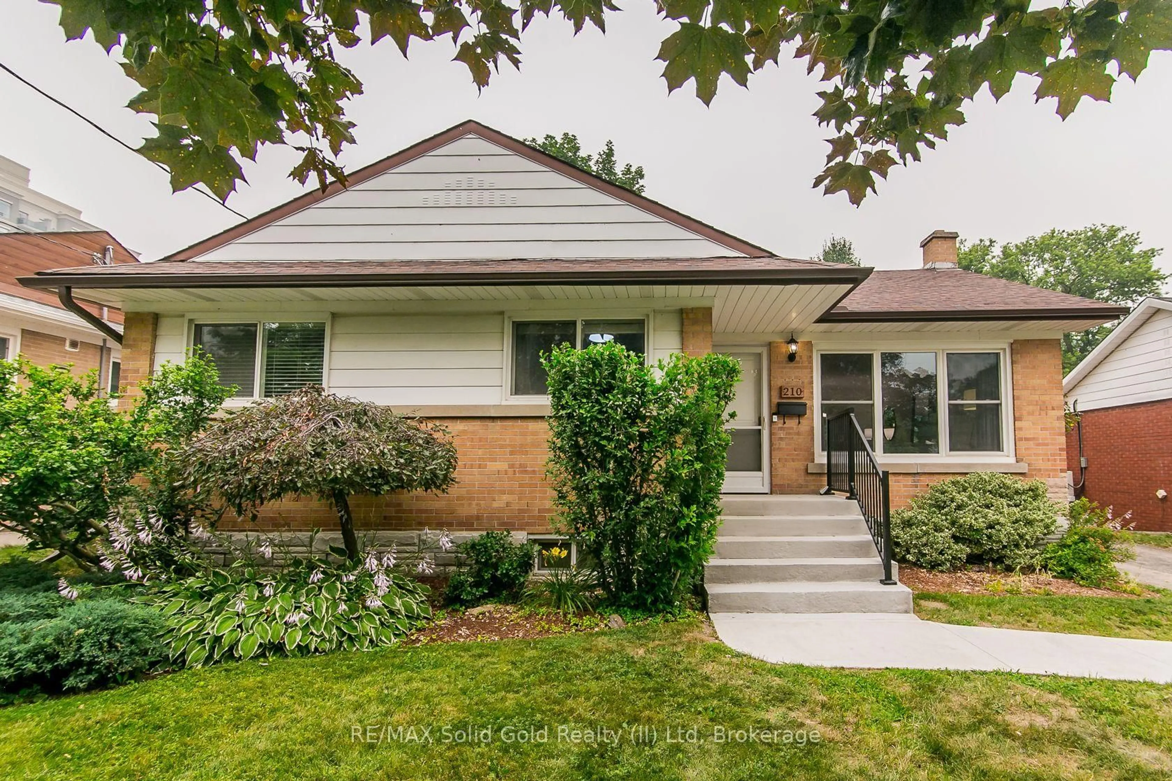 Home with brick exterior material, street for 210 Dawson St, Waterloo Ontario N2L 1S4