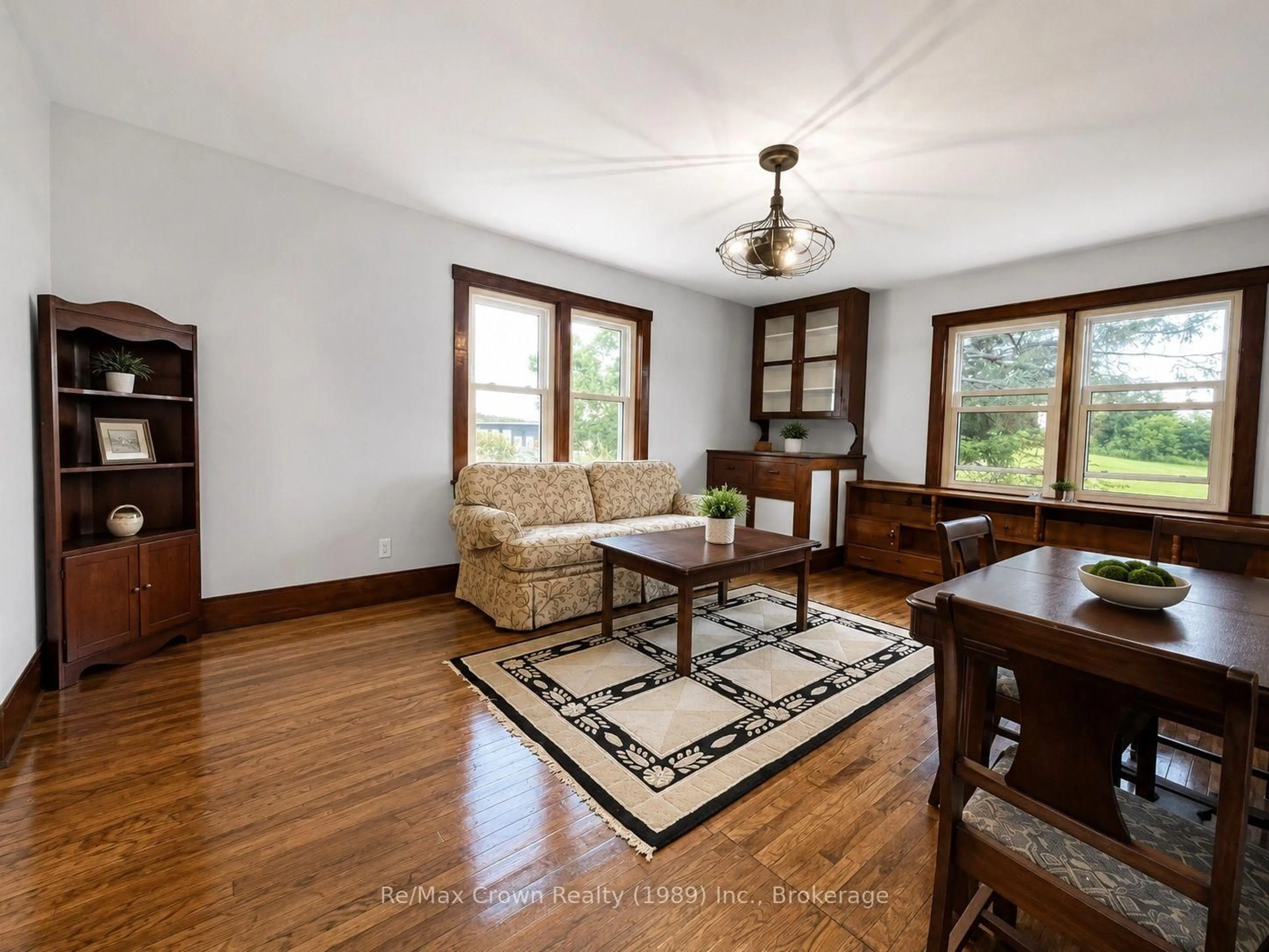 Living room with furniture, wood/laminate floor for 71 Hawthorne Dr, Parry Sound Remote Area Ontario P0H 2R0