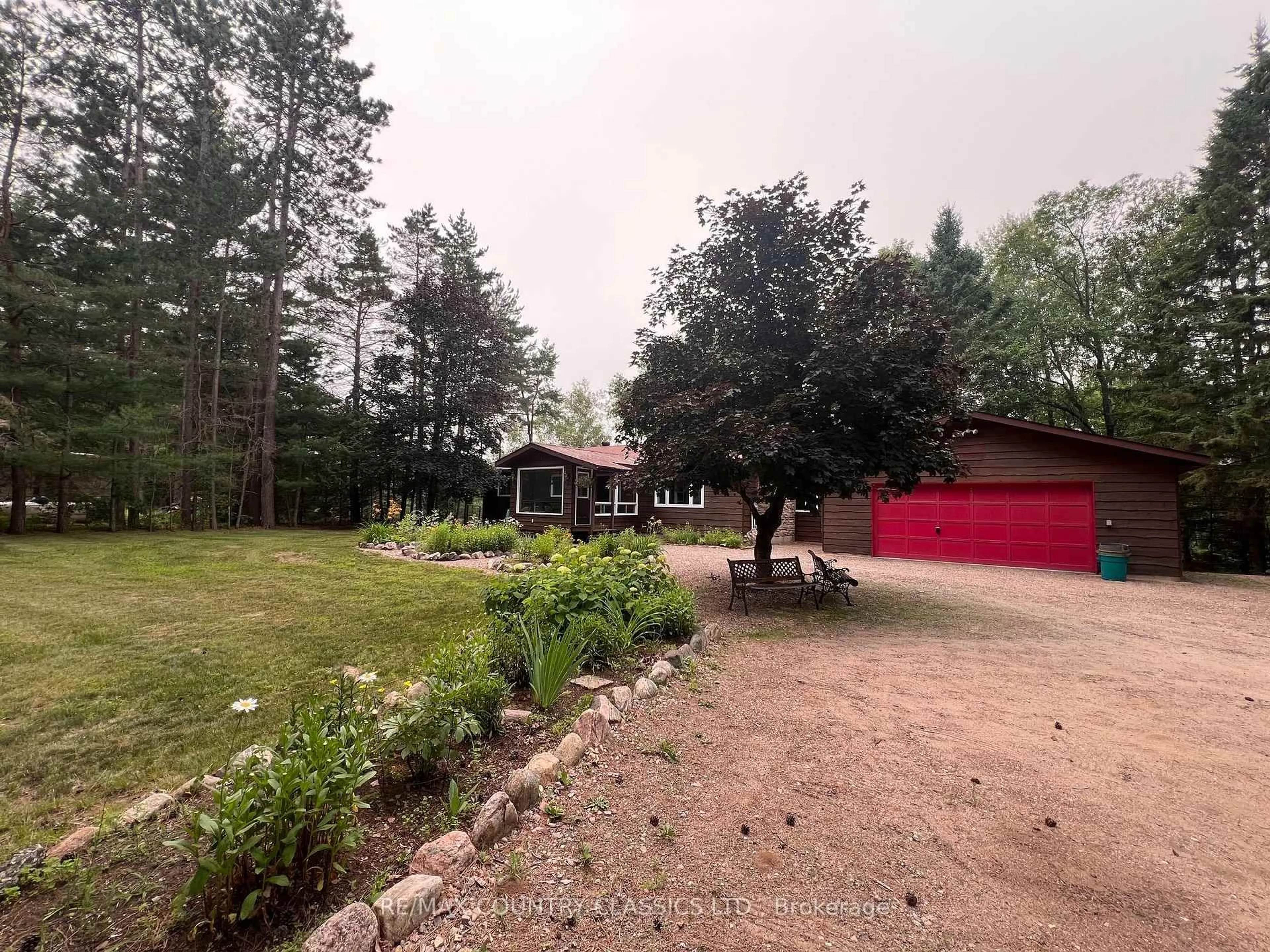 A pic from outside/outdoor area/front of a property/back of a property/a pic from drone, forest/trees view for 24 Firehall Lane, Bancroft Ontario K0L 1C0