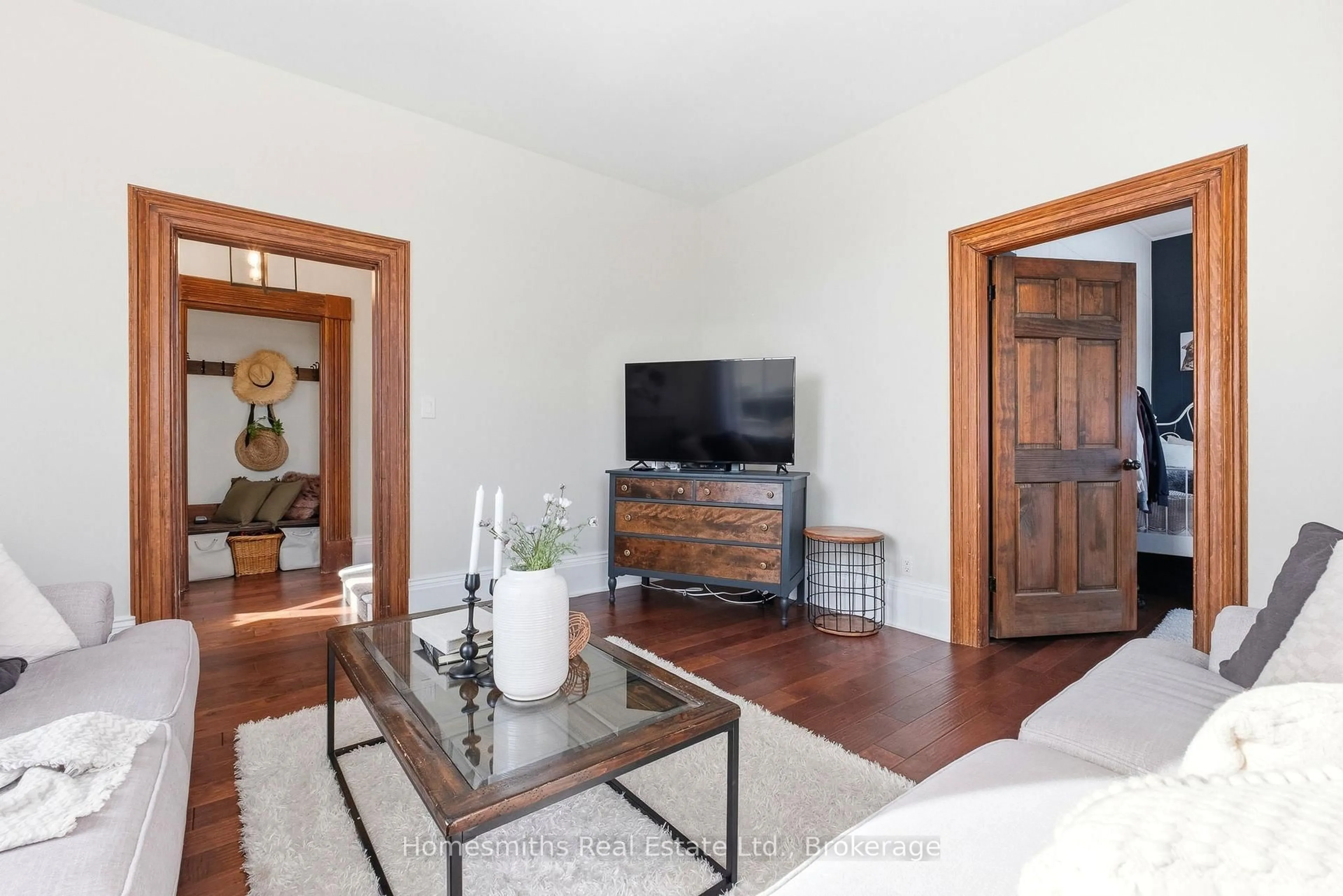 Living room with furniture, wood/laminate floor for 8766 Danforth Rd, Hamilton Township Ontario K9A 0X6