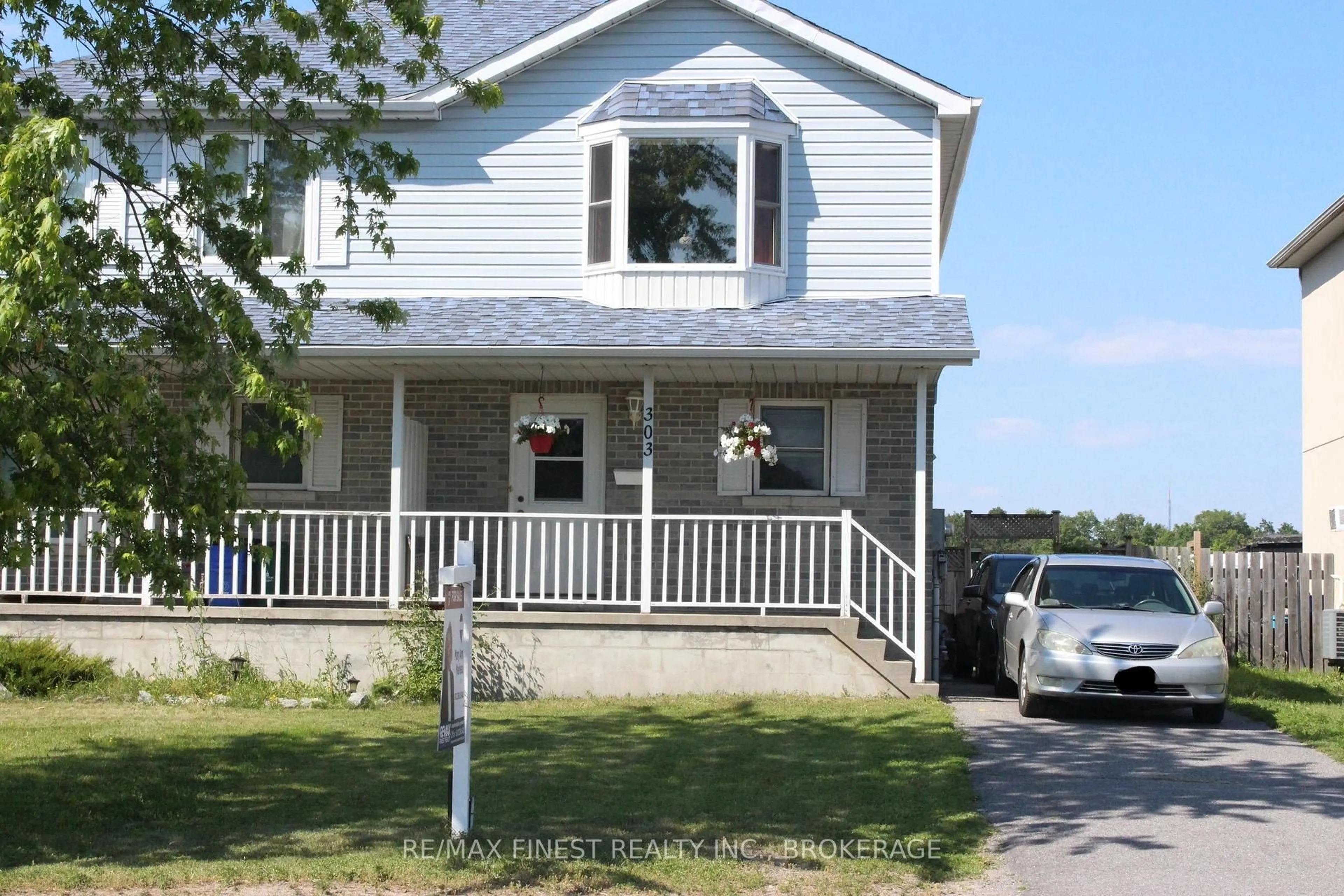 Home with vinyl exterior material, street for 303 Conacher Dr, Kingston Ontario K7K 7J6