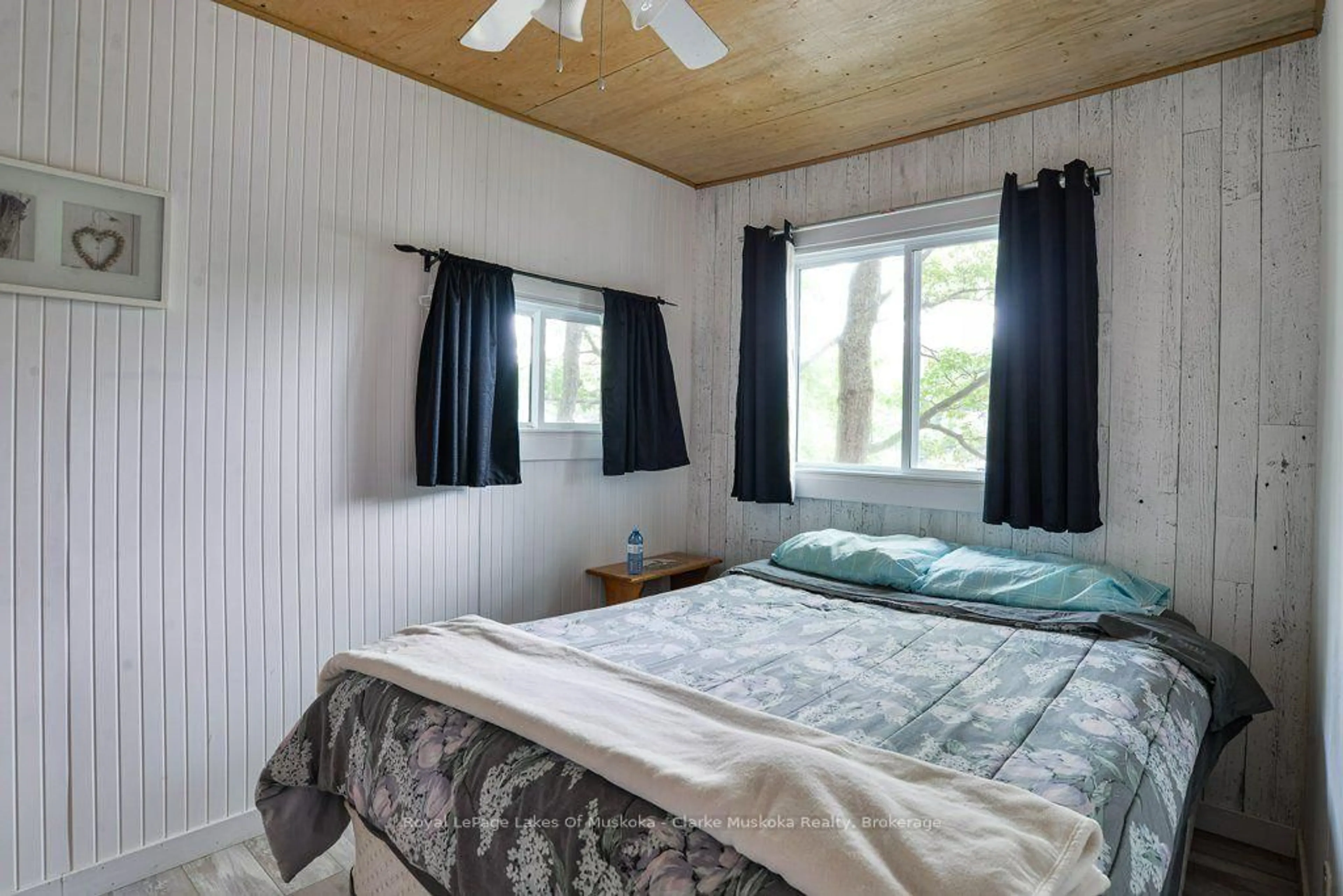 Bedroom with bed, wood/laminate floor for 1053 Harrison Tr, Georgian Bay Ontario P0C 1H0