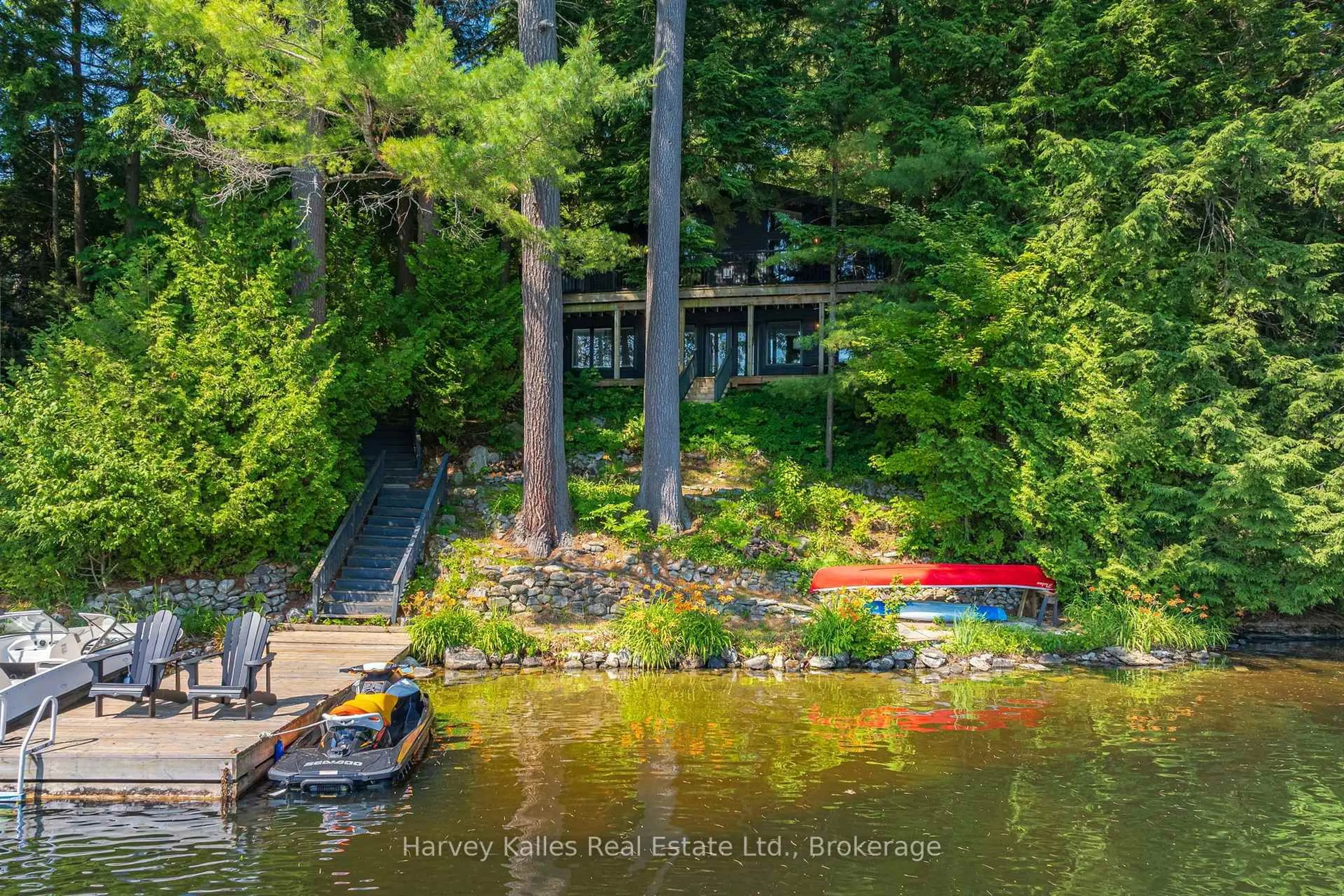 A pic from outside/outdoor area/front of a property/back of a property/a pic from drone, water/lake/river/ocean view for 1075 Hallett Rd, Muskoka Lakes Ontario P0C 1H0