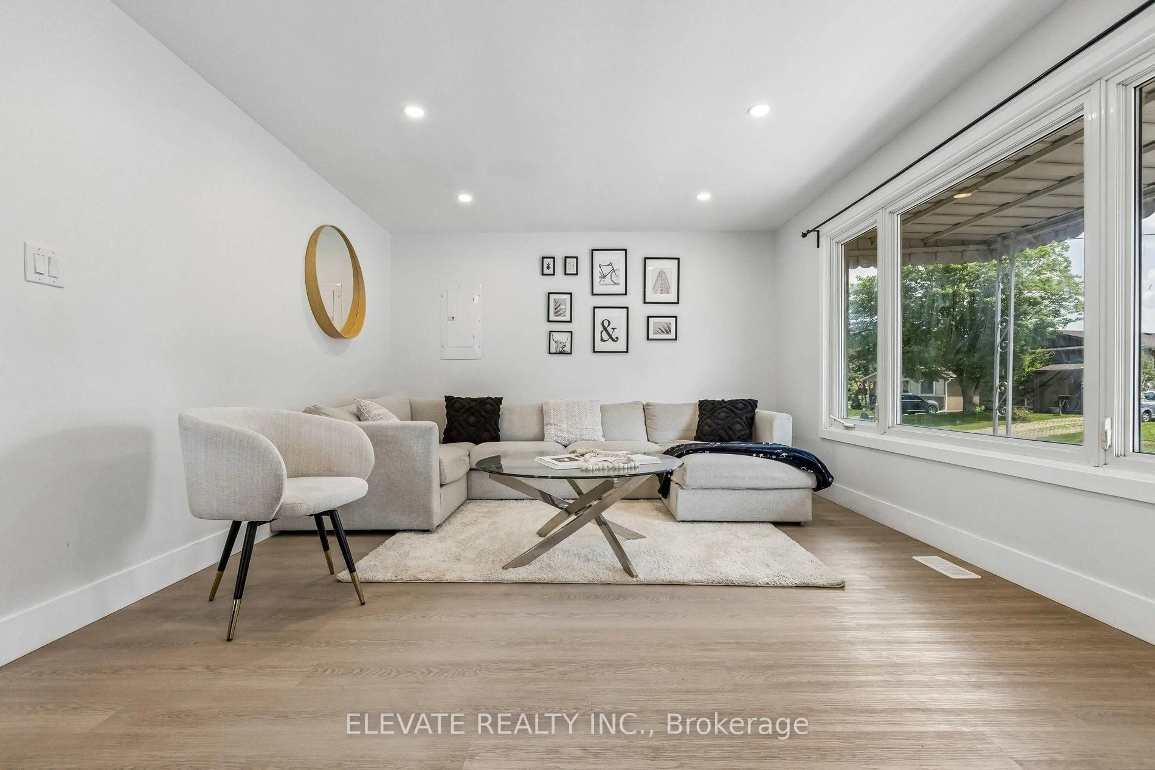 Living room with furniture, wood/laminate floor for 225 Broken Oak Cres, Kitchener Ontario N2N 1N8