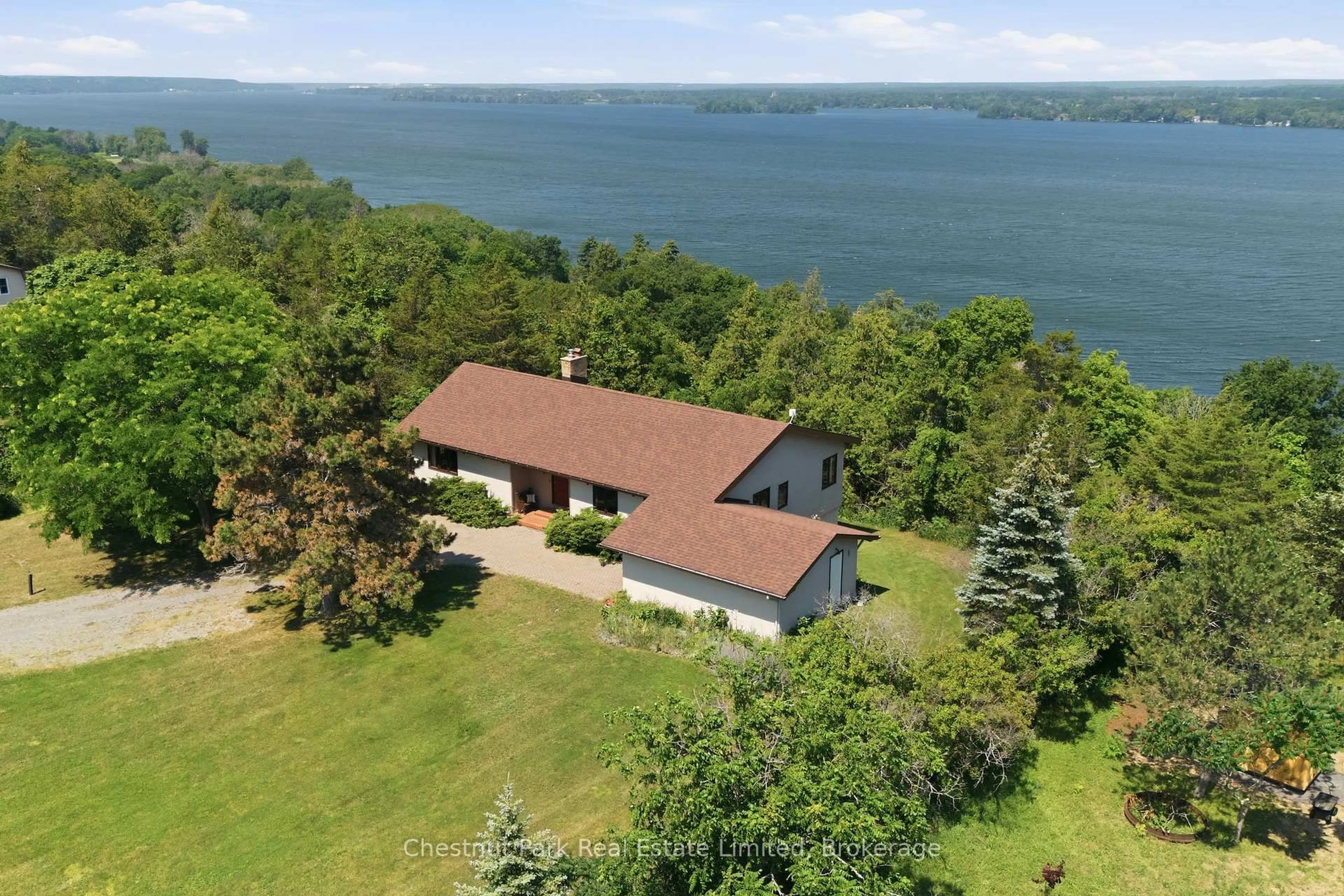 A pic from outside/outdoor area/front of a property/back of a property/a pic from drone, water/lake/river/ocean view for 1979 County Road 7, Prince Edward County Ontario K0K 2T0
