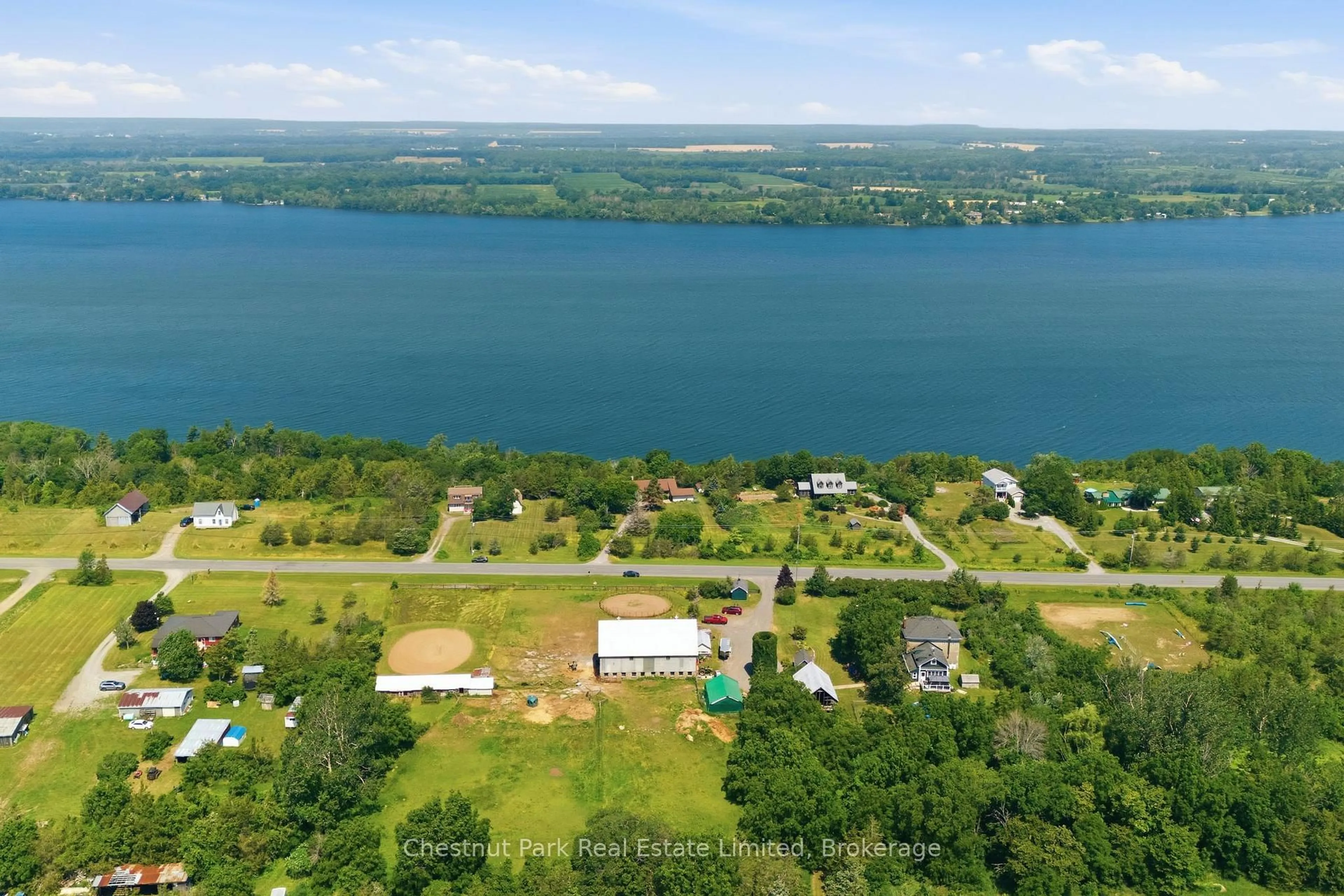 A pic from outside/outdoor area/front of a property/back of a property/a pic from drone, water/lake/river/ocean view for 1979 County Road 7, Prince Edward County Ontario K0K 2T0