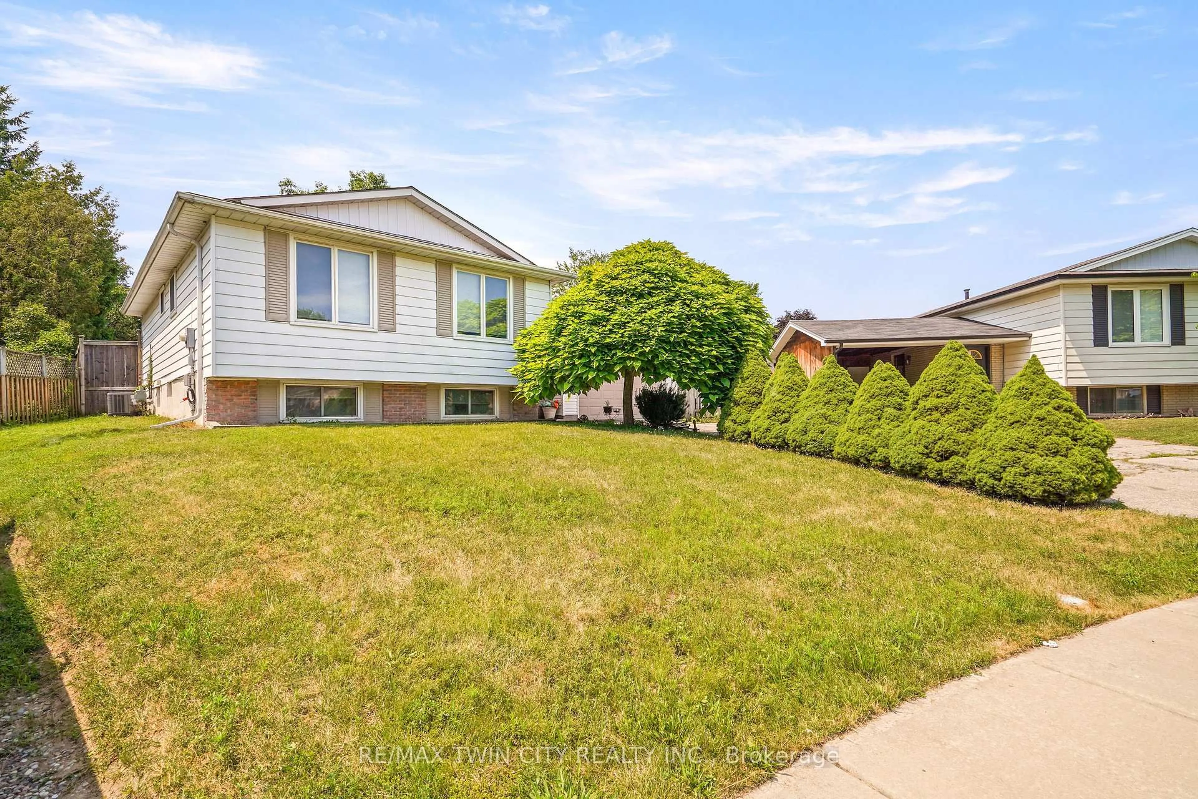 Home with vinyl exterior material, street for 14 Thistledown Dr, Brantford Ontario N3R 6R9