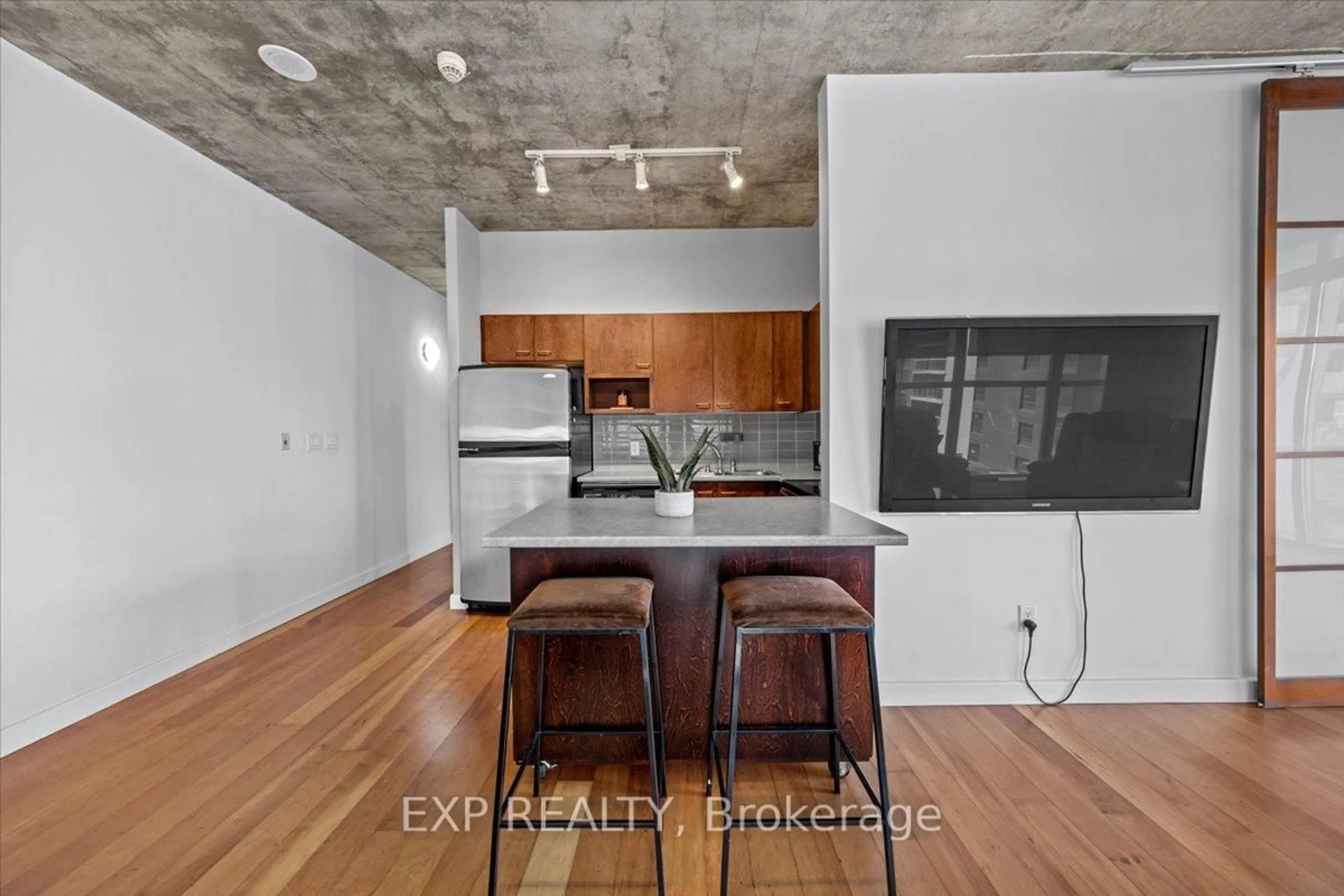 Open concept kitchen, cement floor for 179 GEORGE St #603, Ottawa Ontario K1N 1J8