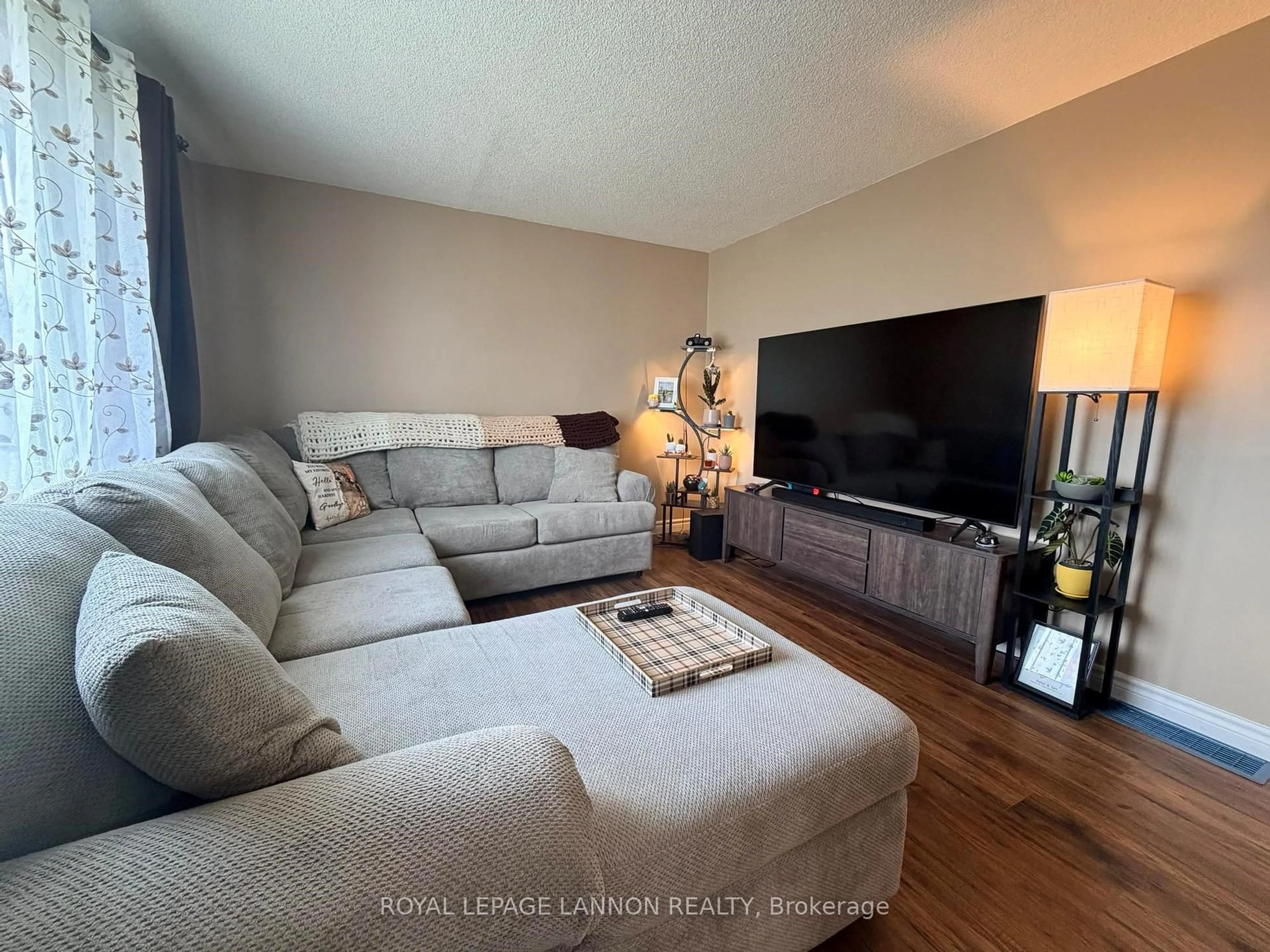 Living room with furniture, wood/laminate floor for 312 Ball Park Cres, Greenstone Ontario P0T 1M0