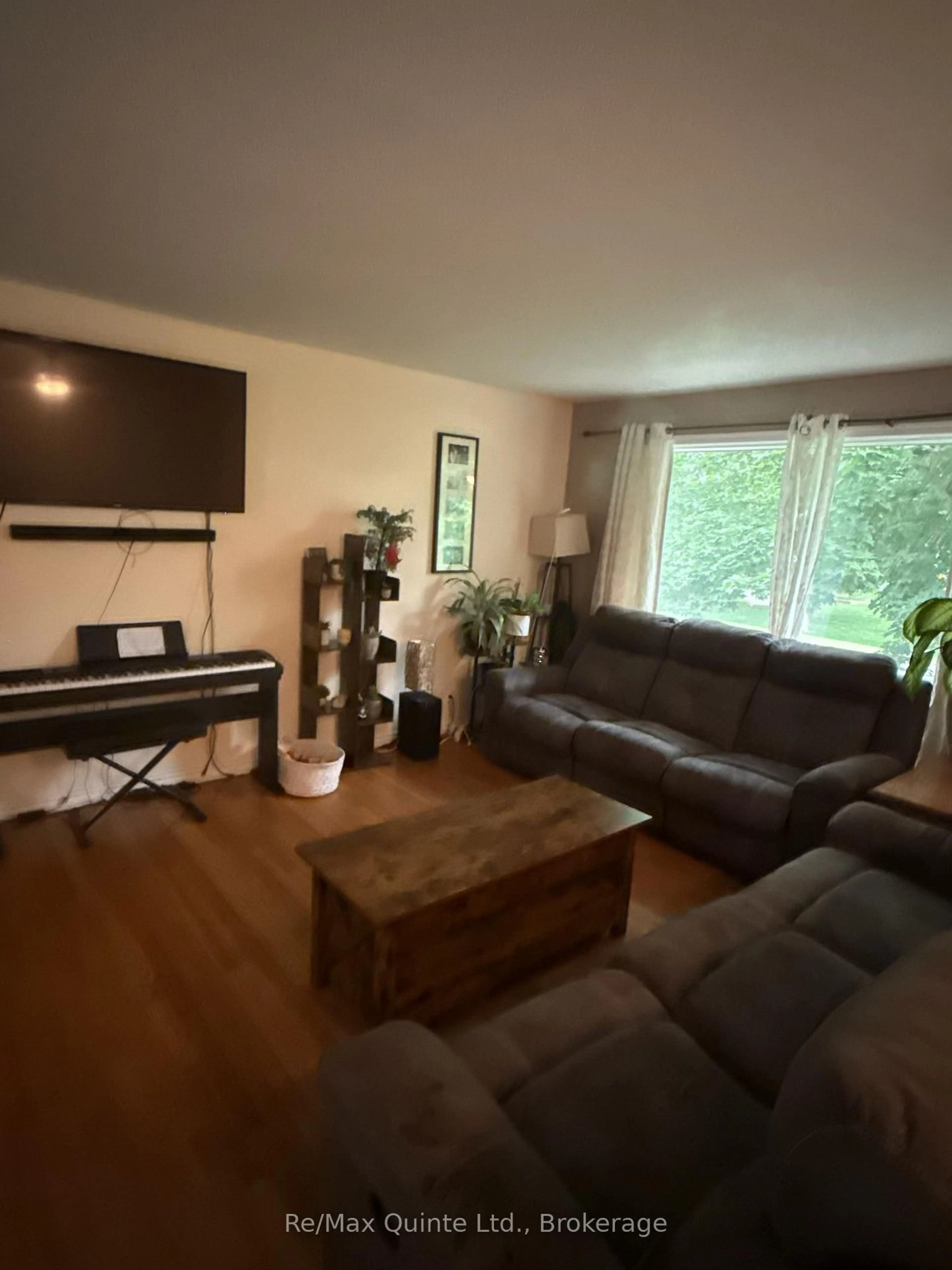 Living room with furniture, wood/laminate floor for 94 Grenville Park Dr, Hastings Ontario K0K 2C0