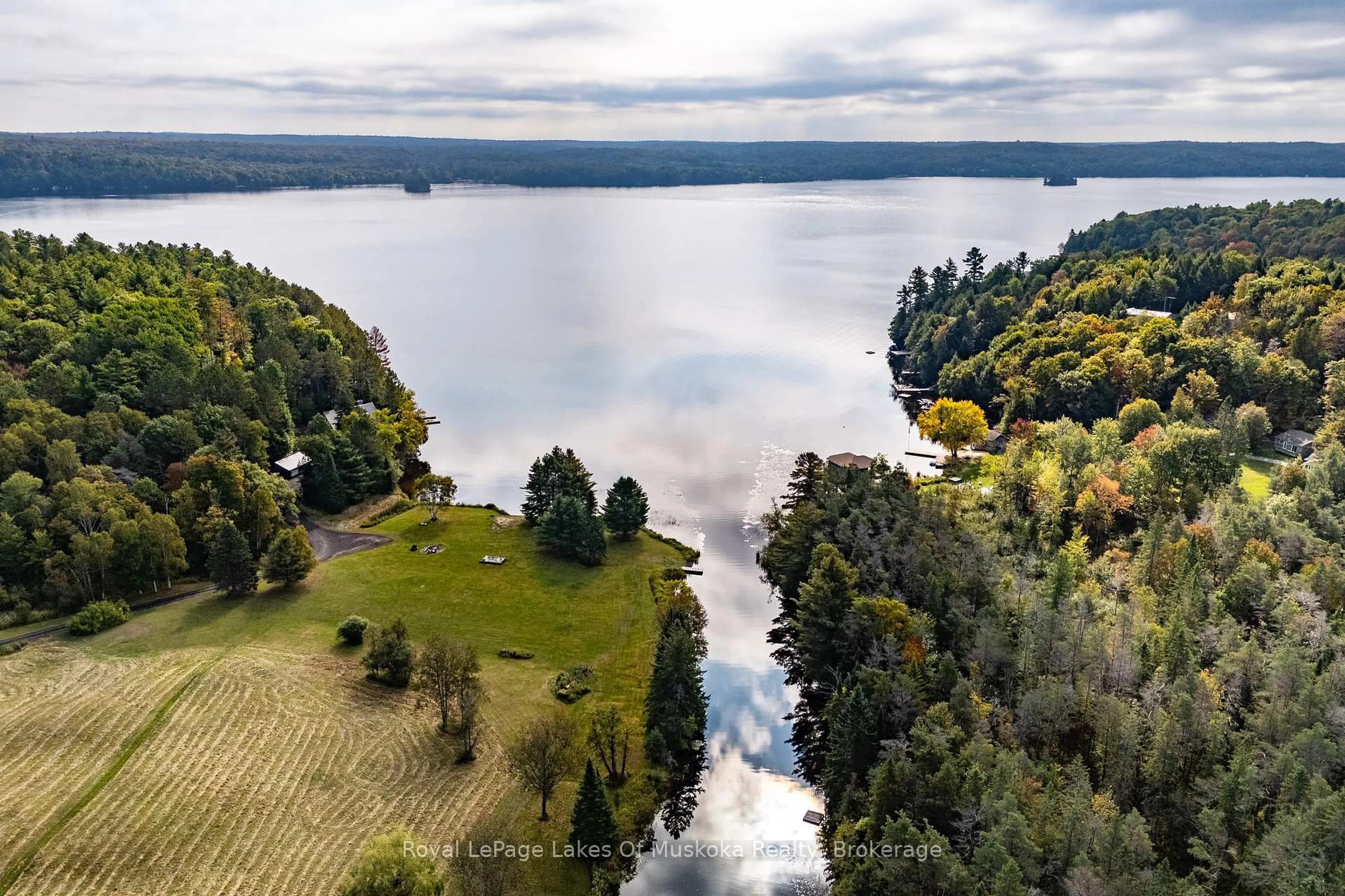 A pic from outside/outdoor area/front of a property/back of a property/a pic from drone, water/lake/river/ocean view for 461 Rowanwood Rd, Huntsville Ontario P0B 1M0