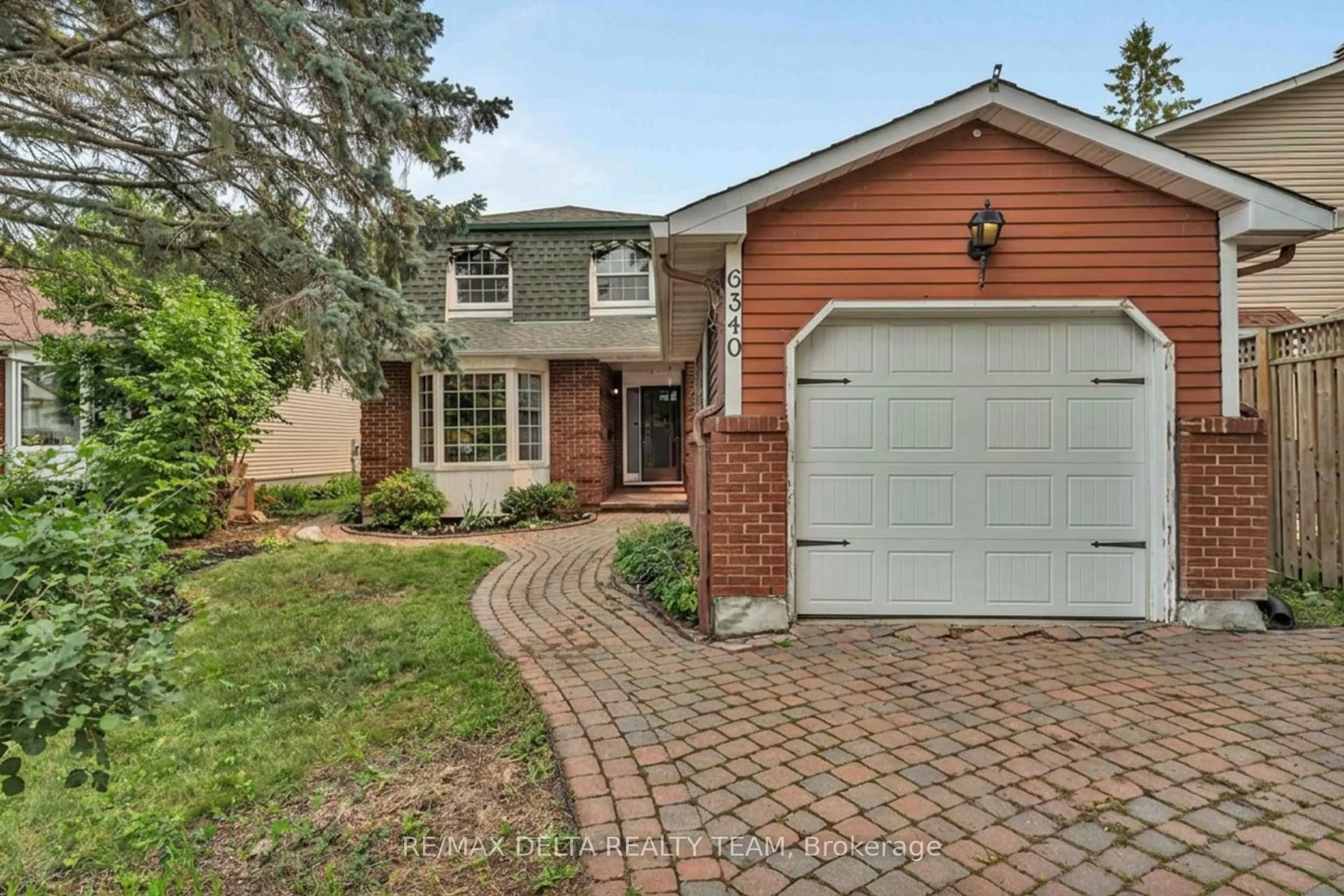 Home with brick exterior material, street for 6340 Fortune Dr, Orleans Ontario K1C 1Z6