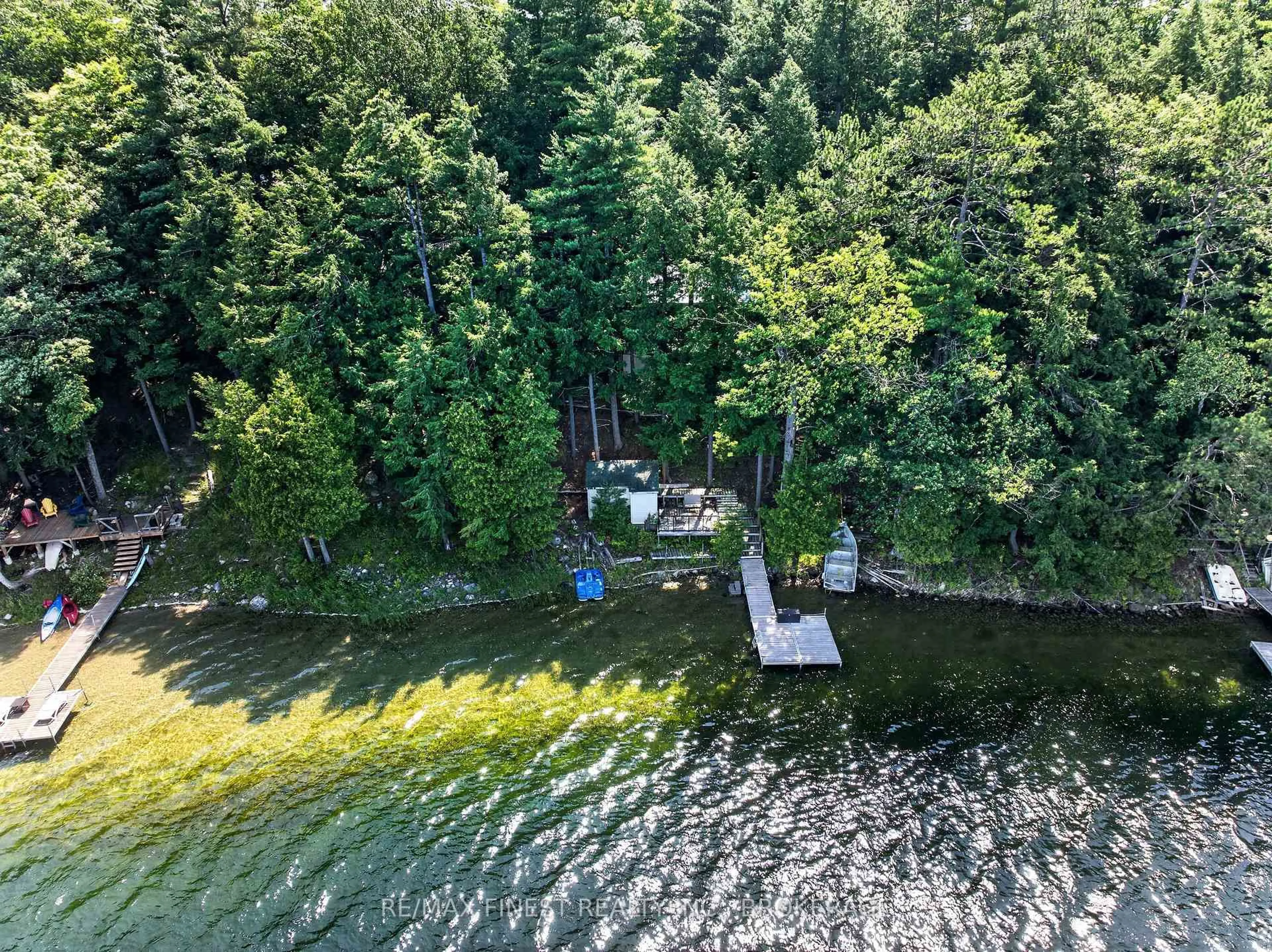 A pic from outside/outdoor area/front of a property/back of a property/a pic from drone, water/lake/river/ocean view for 701 Davern Lane, Maberly Ontario K0H 2B0