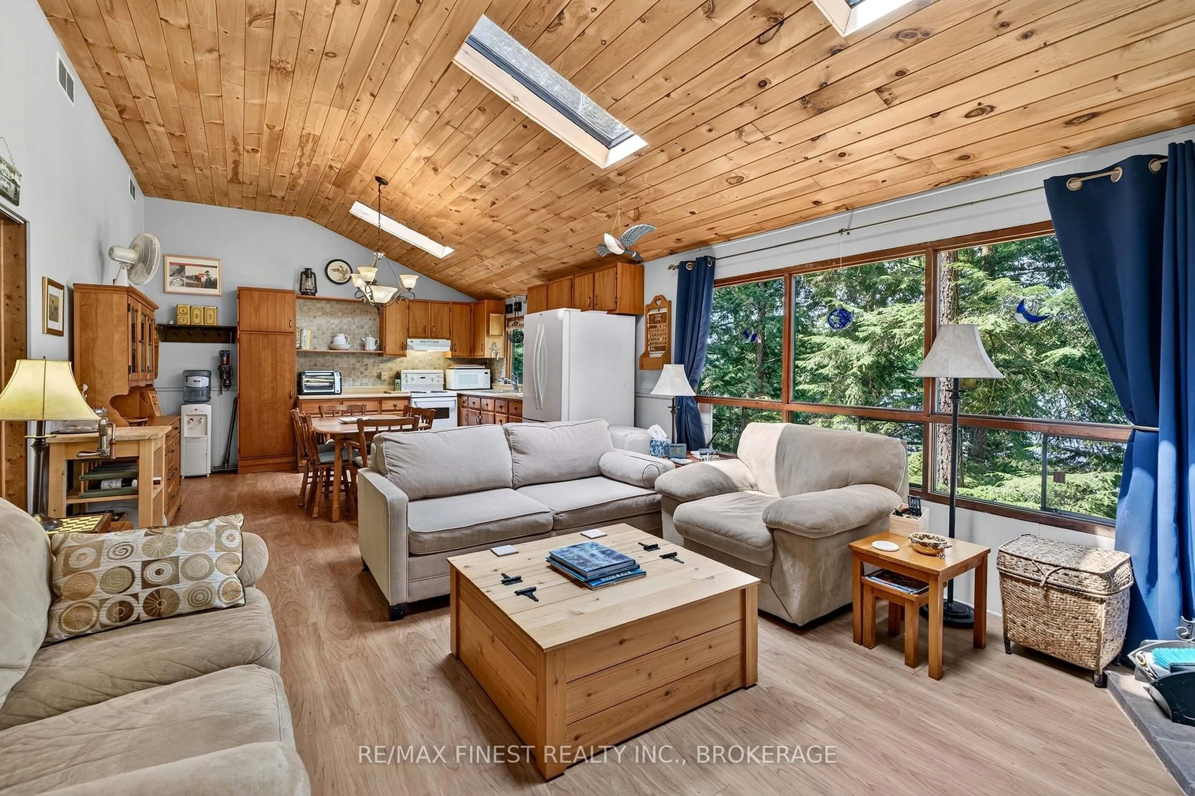 Living room with furniture, wood/laminate floor for 701 Davern Lane, Maberly Ontario K0H 2B0