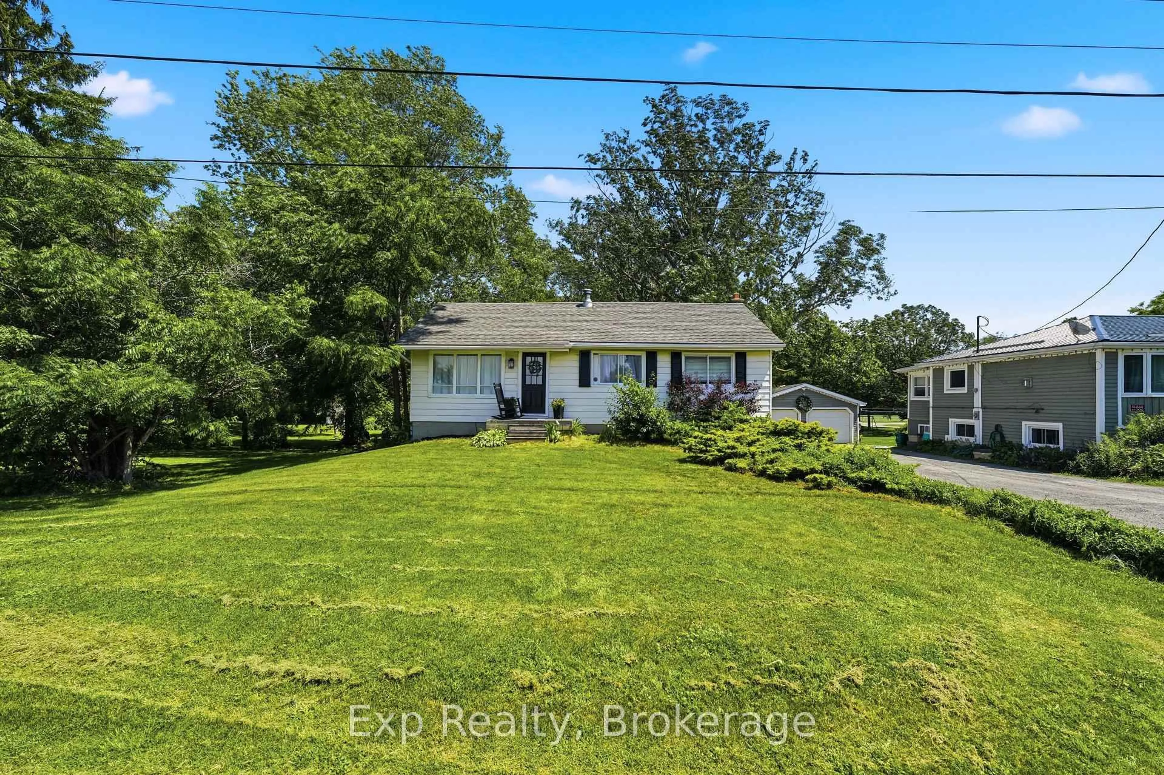 A pic from outside/outdoor area/front of a property/back of a property/a pic from drone, water/lake/river/ocean view for 650 County Road 5, Prince Edward County Ontario K0K 2T0
