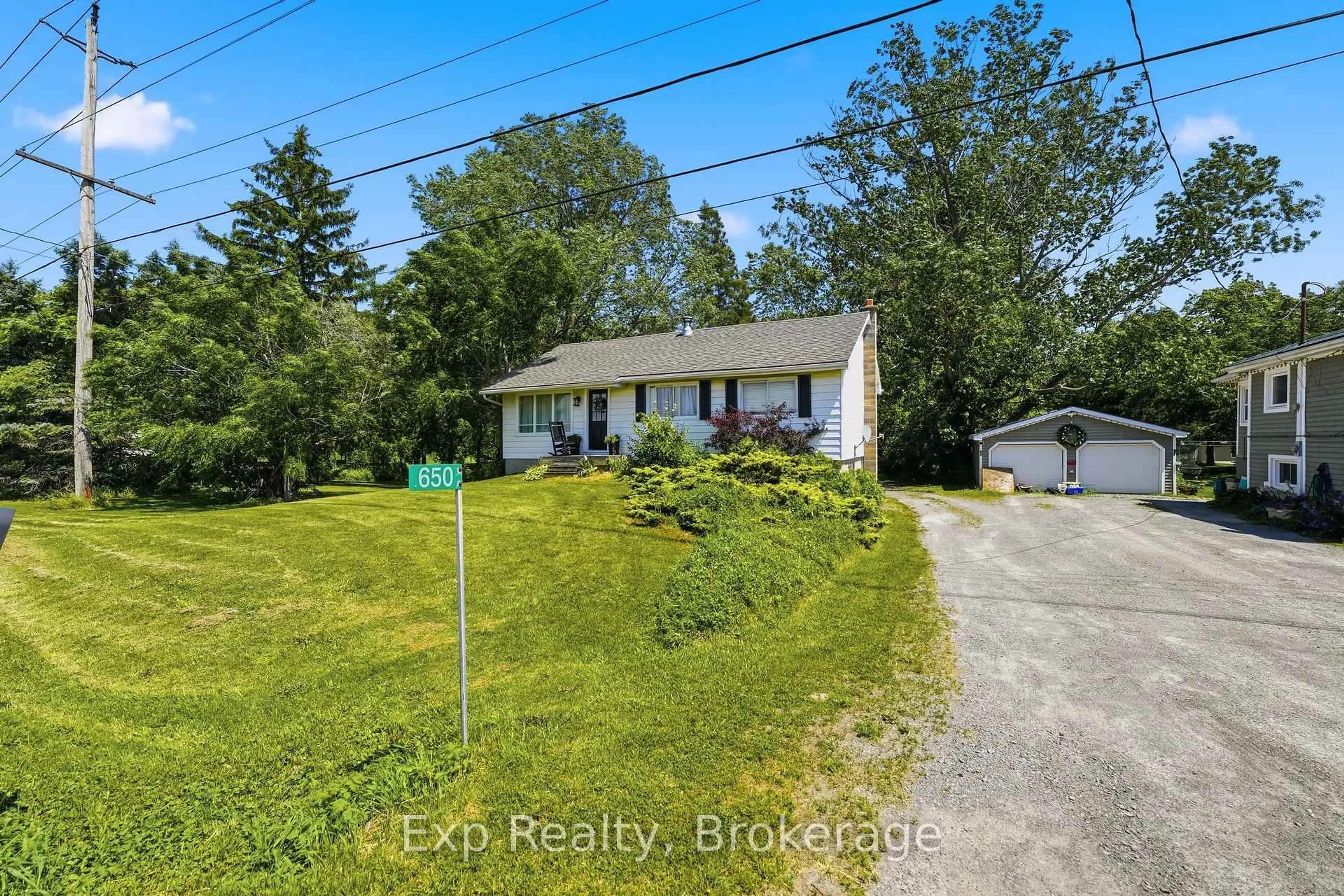 A pic from outside/outdoor area/front of a property/back of a property/a pic from drone, water/lake/river/ocean view for 650 County Road 5, Prince Edward County Ontario K0K 2T0