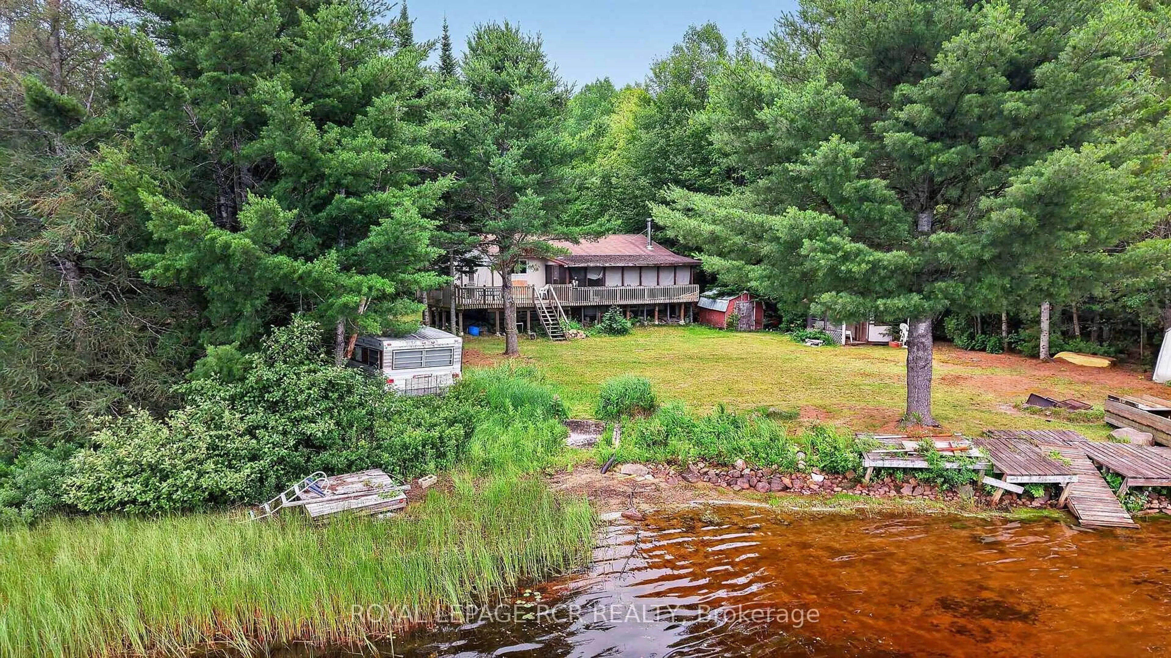 A pic from outside/outdoor area/front of a property/back of a property/a pic from drone, water/lake/river/ocean view for 1101 Peter Rd, Bracebridge Ontario P1L 1X3