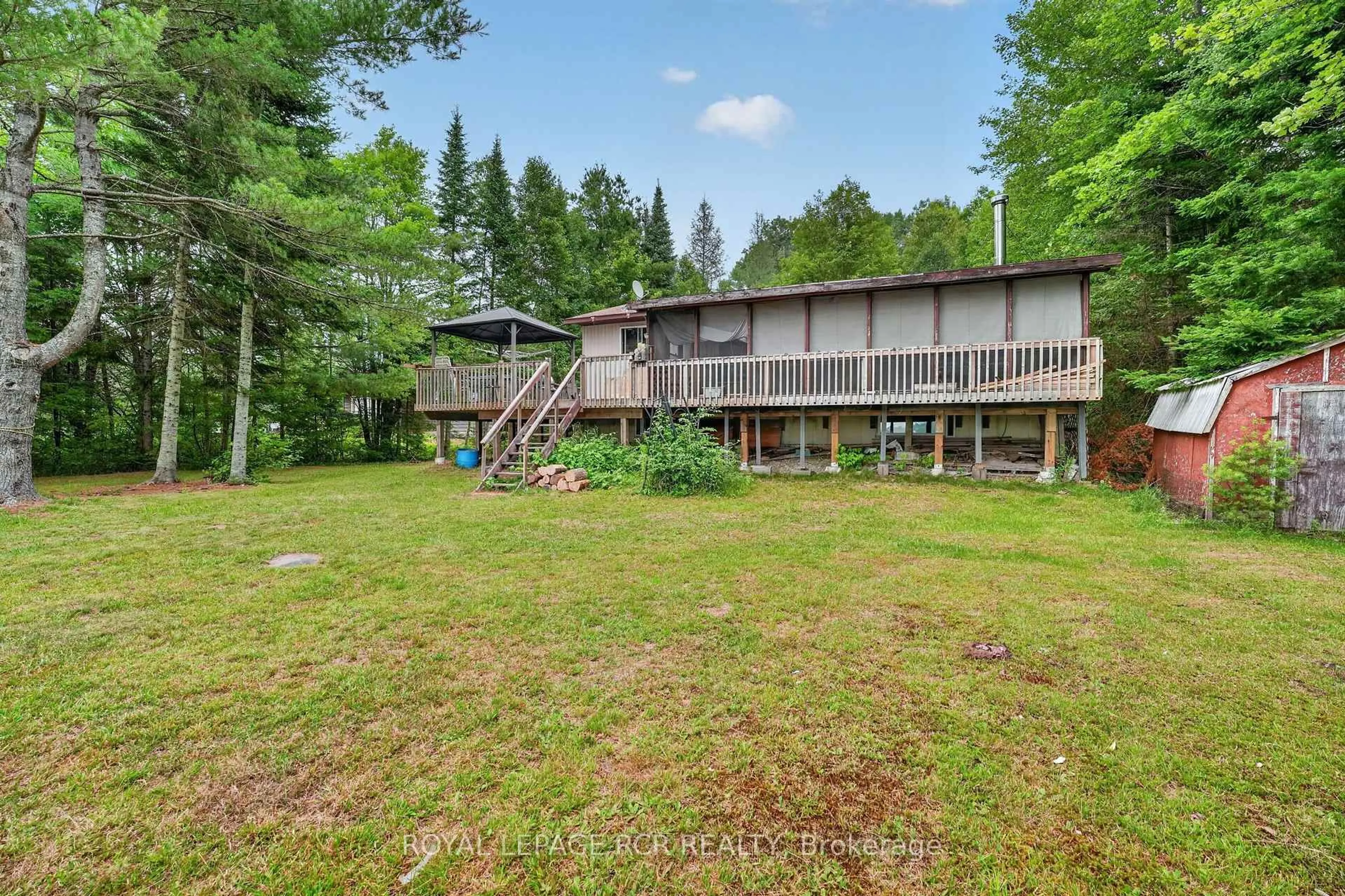A pic from outside/outdoor area/front of a property/back of a property/a pic from drone, water/lake/river/ocean view for 1101 Peter Rd, Bracebridge Ontario P1L 1X3