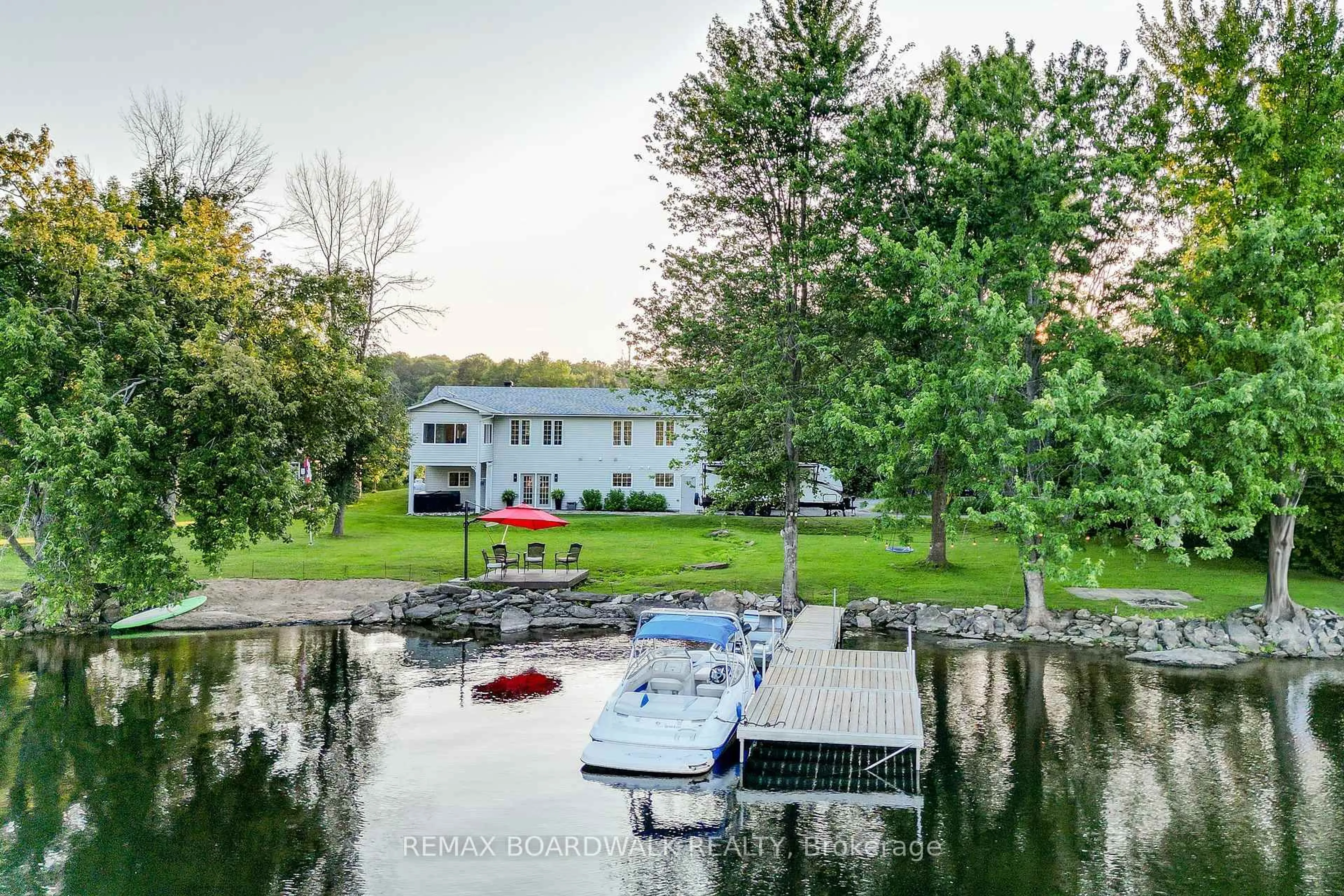 A pic from outside/outdoor area/front of a property/back of a property/a pic from drone, water/lake/river/ocean view for 100 Mcculloughs Landing, Perth Ontario K7H 3C8