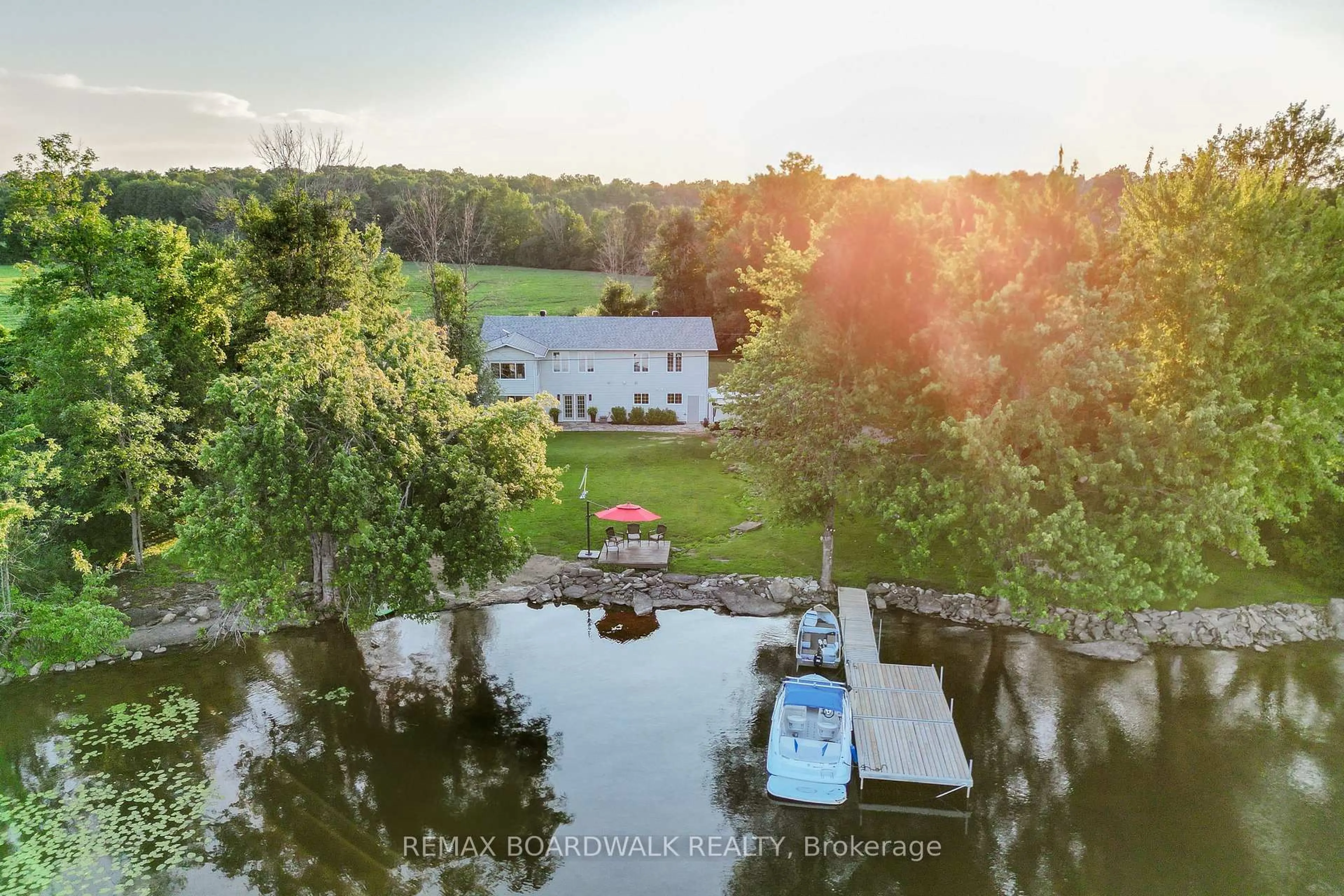 A pic from outside/outdoor area/front of a property/back of a property/a pic from drone, water/lake/river/ocean view for 100 Mcculloughs Landing, Perth Ontario K7H 3C8