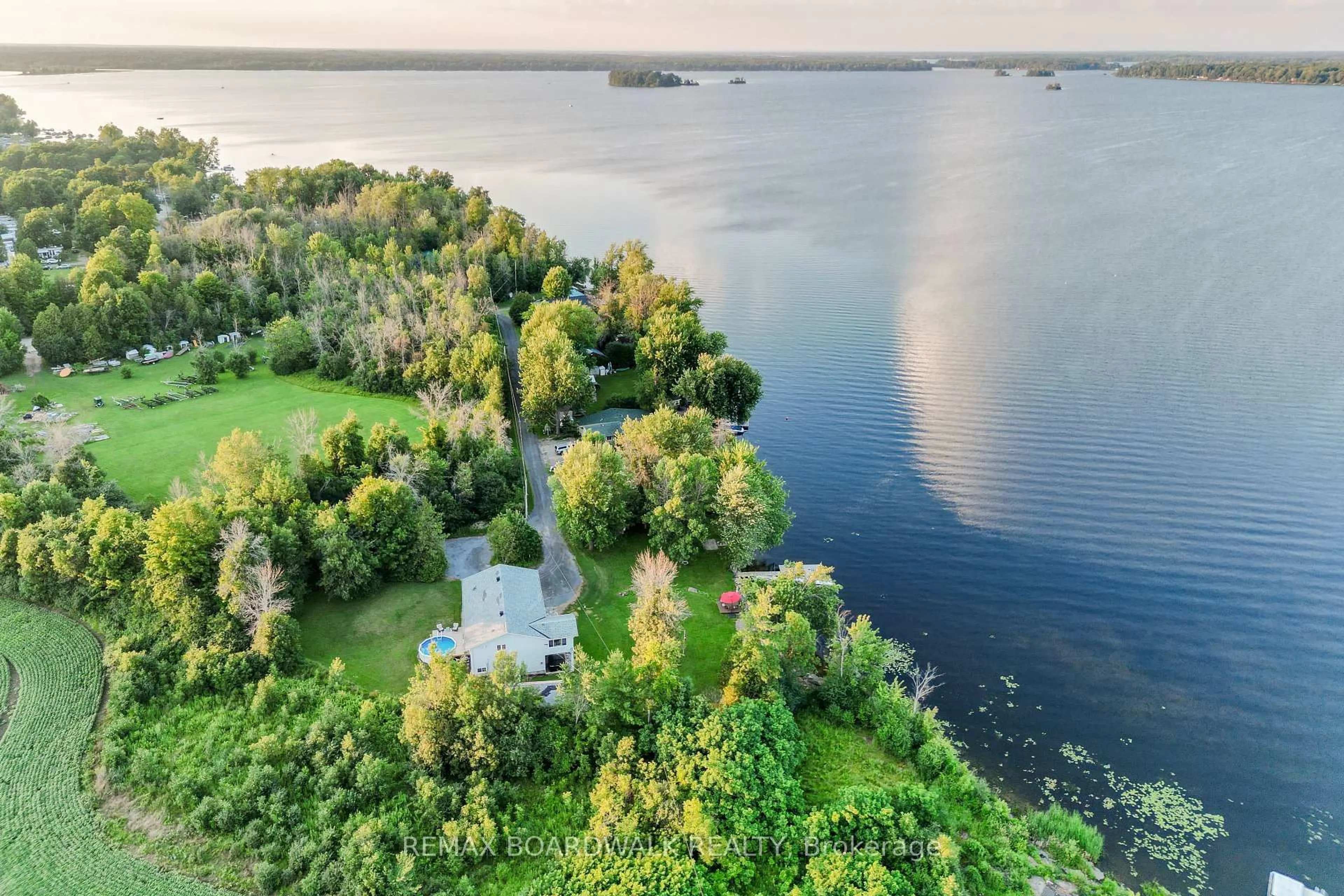 A pic from outside/outdoor area/front of a property/back of a property/a pic from drone, water/lake/river/ocean view for 100 Mcculloughs Landing, Perth Ontario K7H 3C8