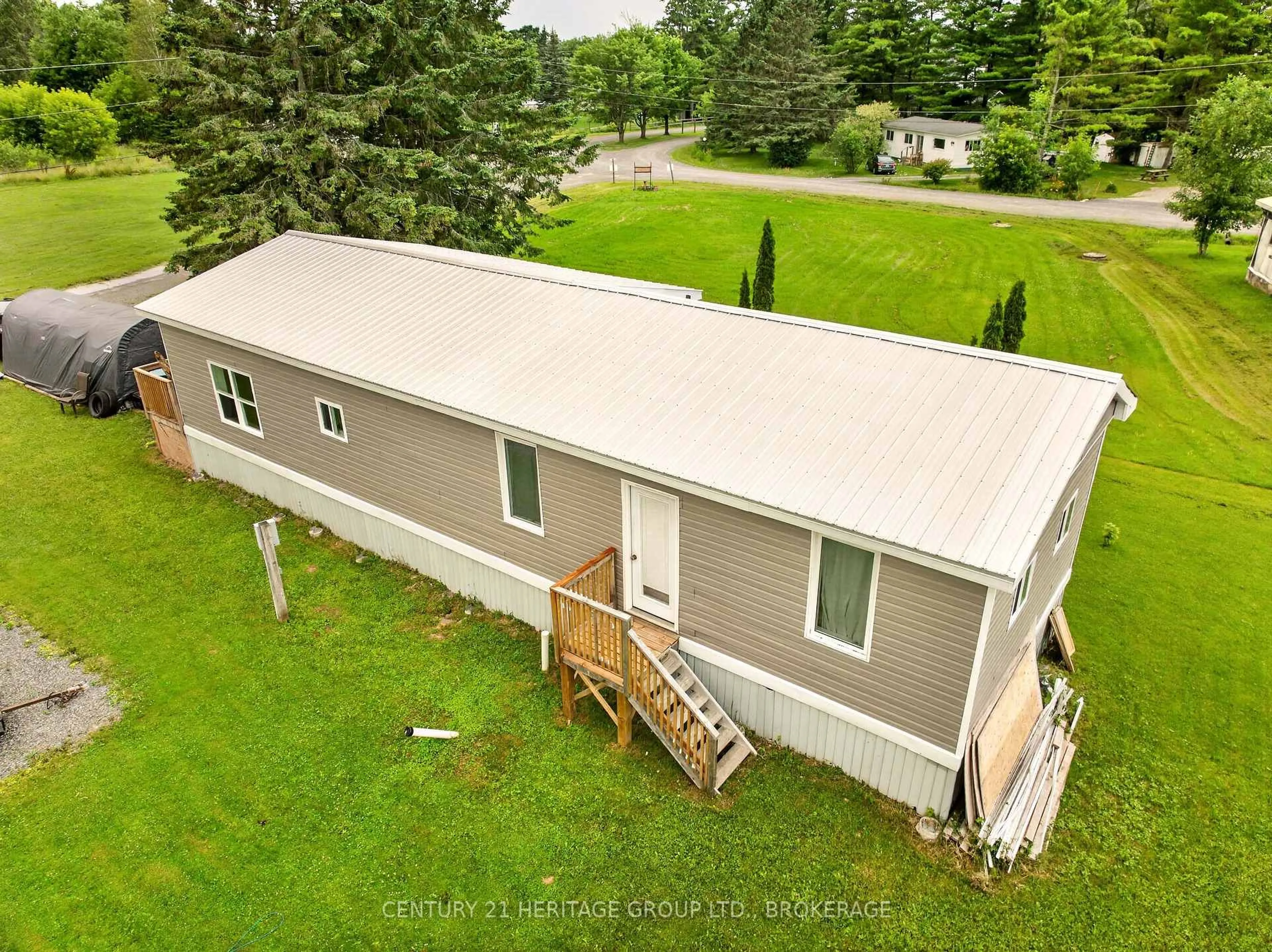 A pic from outside/outdoor area/front of a property/back of a property/a pic from drone, unknown for 7 PATTERSON Rd, Rideau Lakes Ontario K0G 1E0