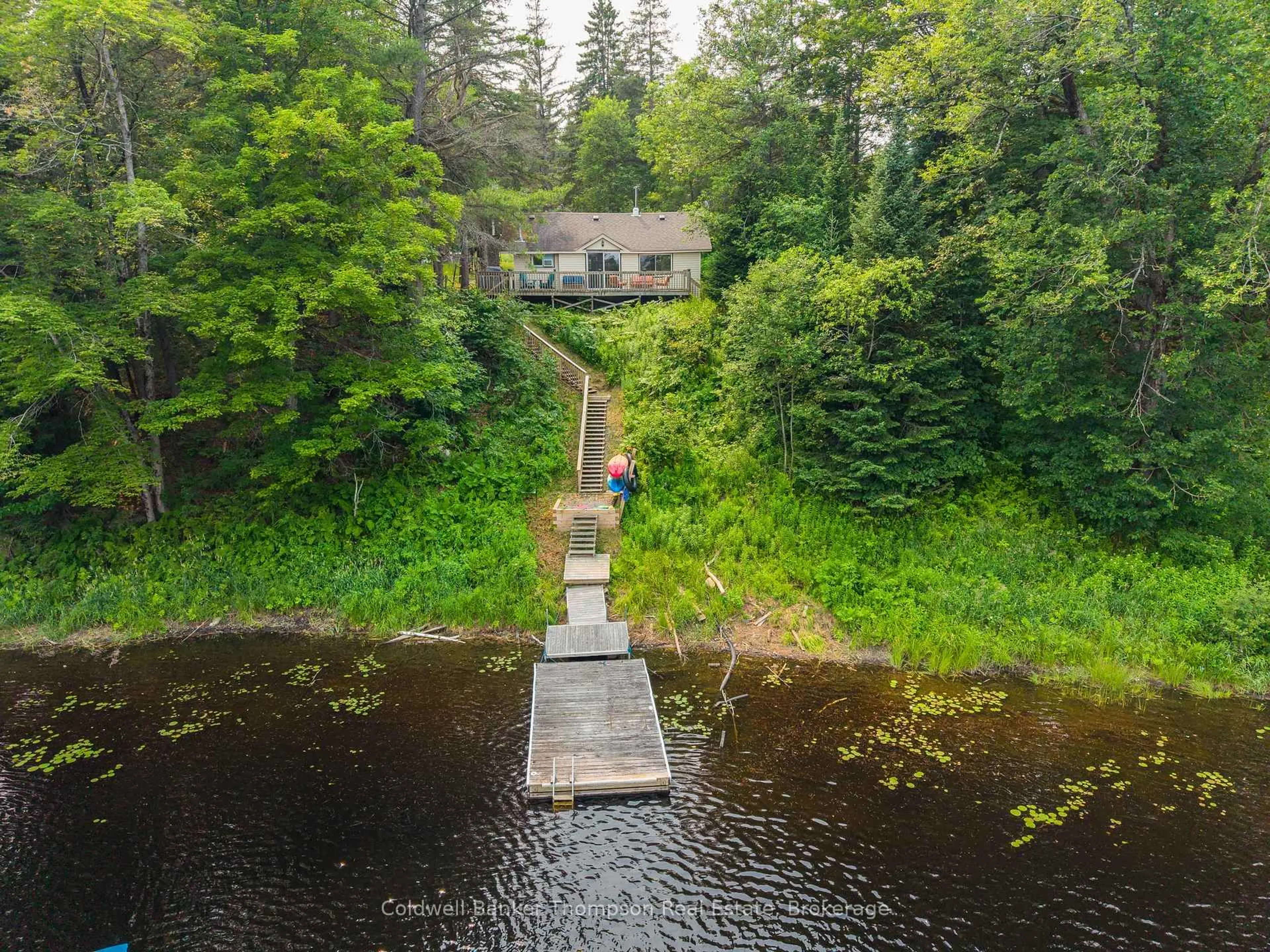 A pic from outside/outdoor area/front of a property/back of a property/a pic from drone, water/lake/river/ocean view for 880 Stephenson Rd 2 Rd, Huntsville Ontario P0B 1L0
