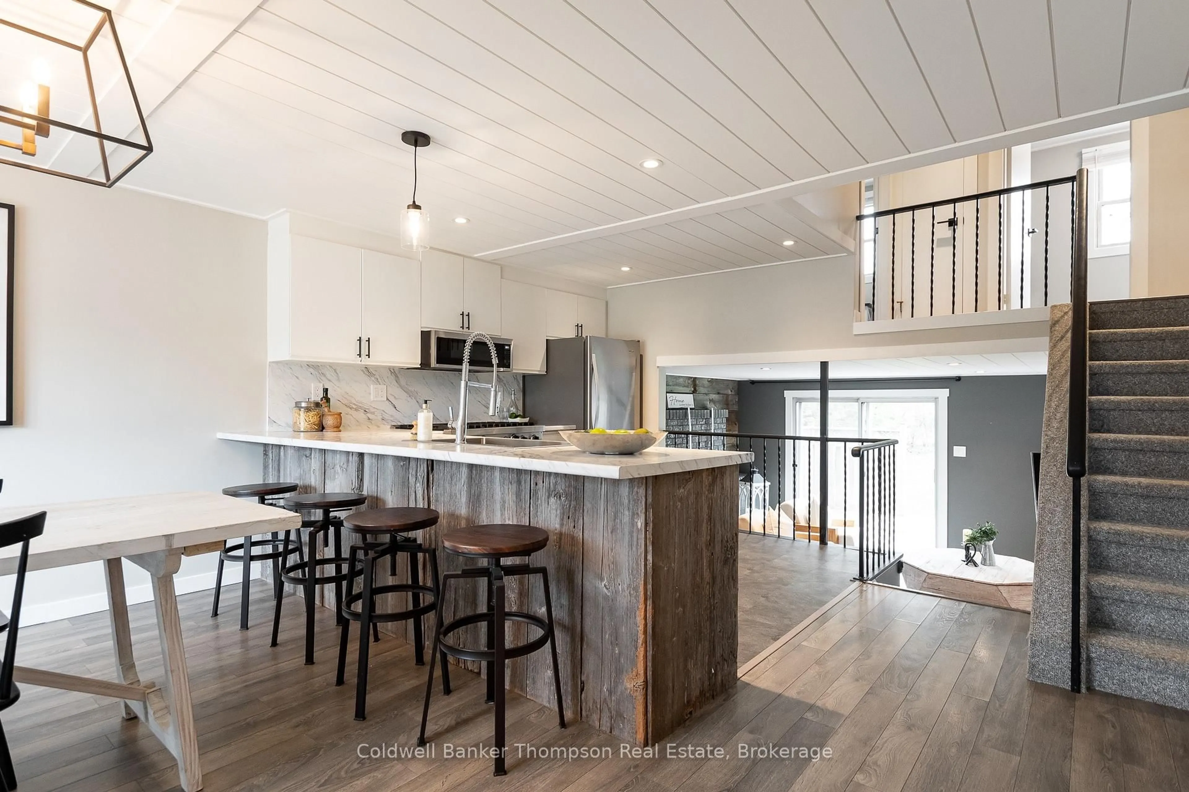 Open concept kitchen, wood/laminate floor for 107 Spencer St, Bracebridge Ontario P1L 1C3