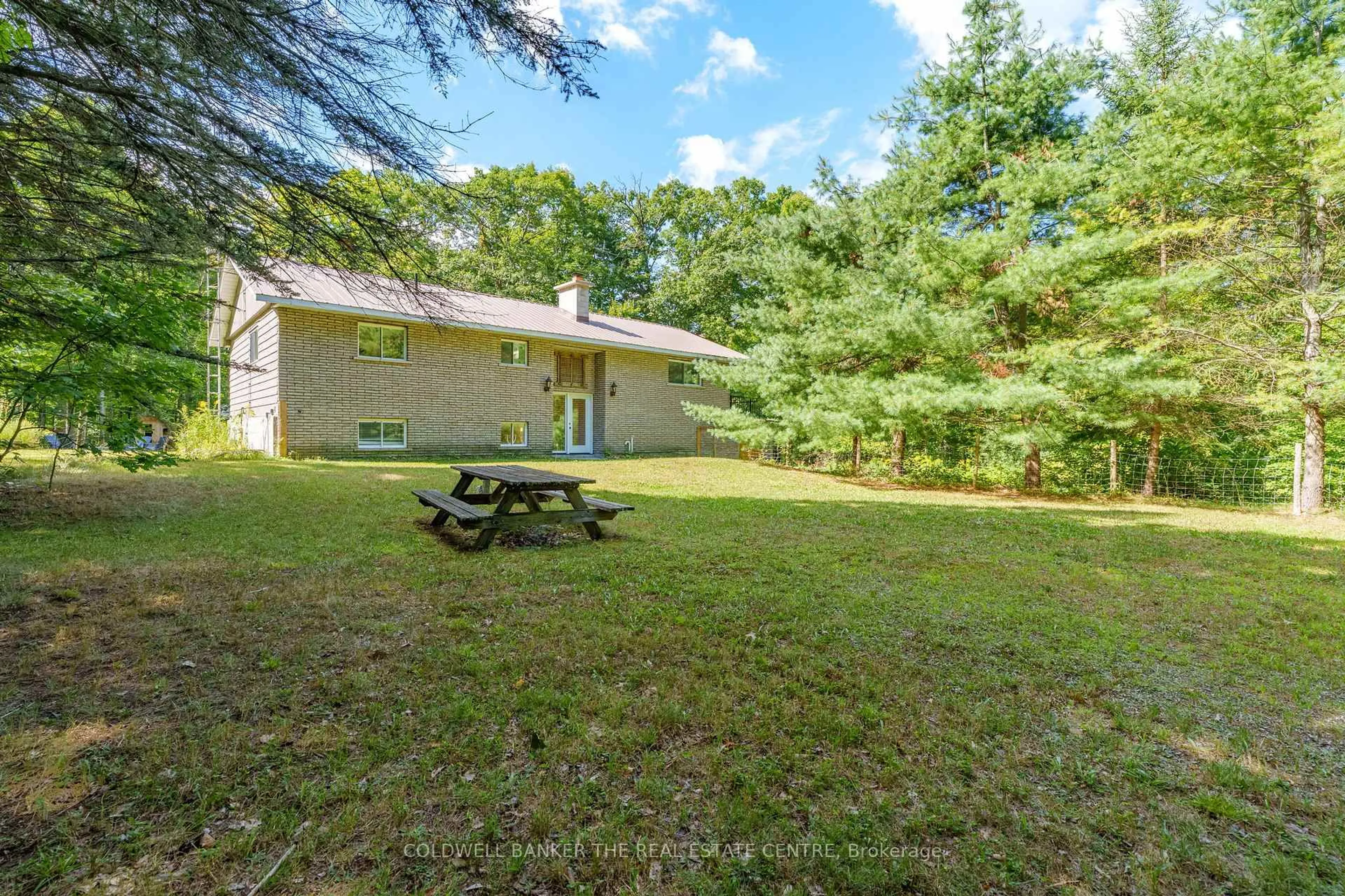 Patio, forest/trees view for 1100 Mortimers Point Rd, Muskoka Lakes Ontario P0B 1J0