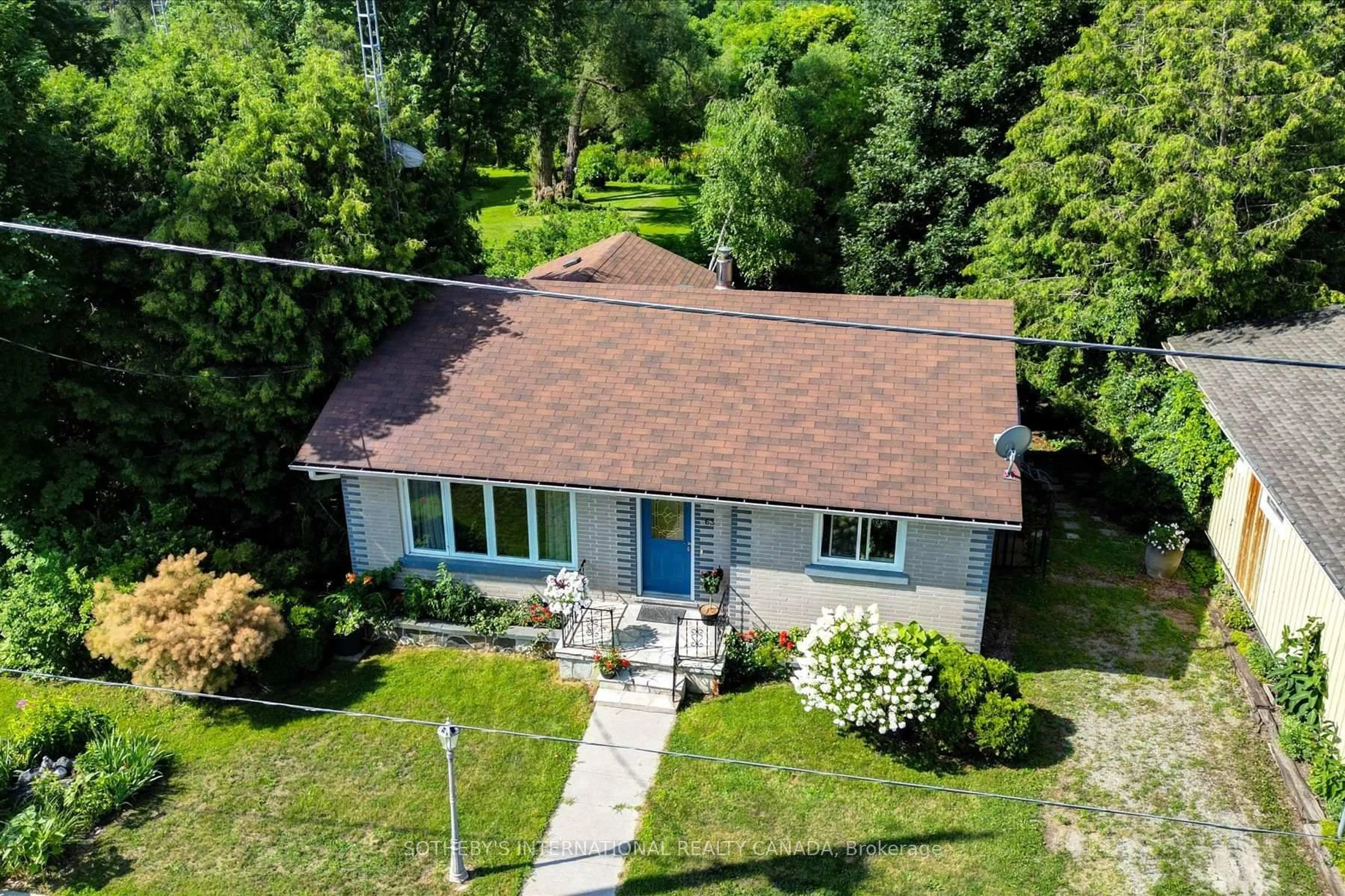A pic from outside/outdoor area/front of a property/back of a property/a pic from drone, street for 63 Main St, Trent Hills Ontario K0K 3K0