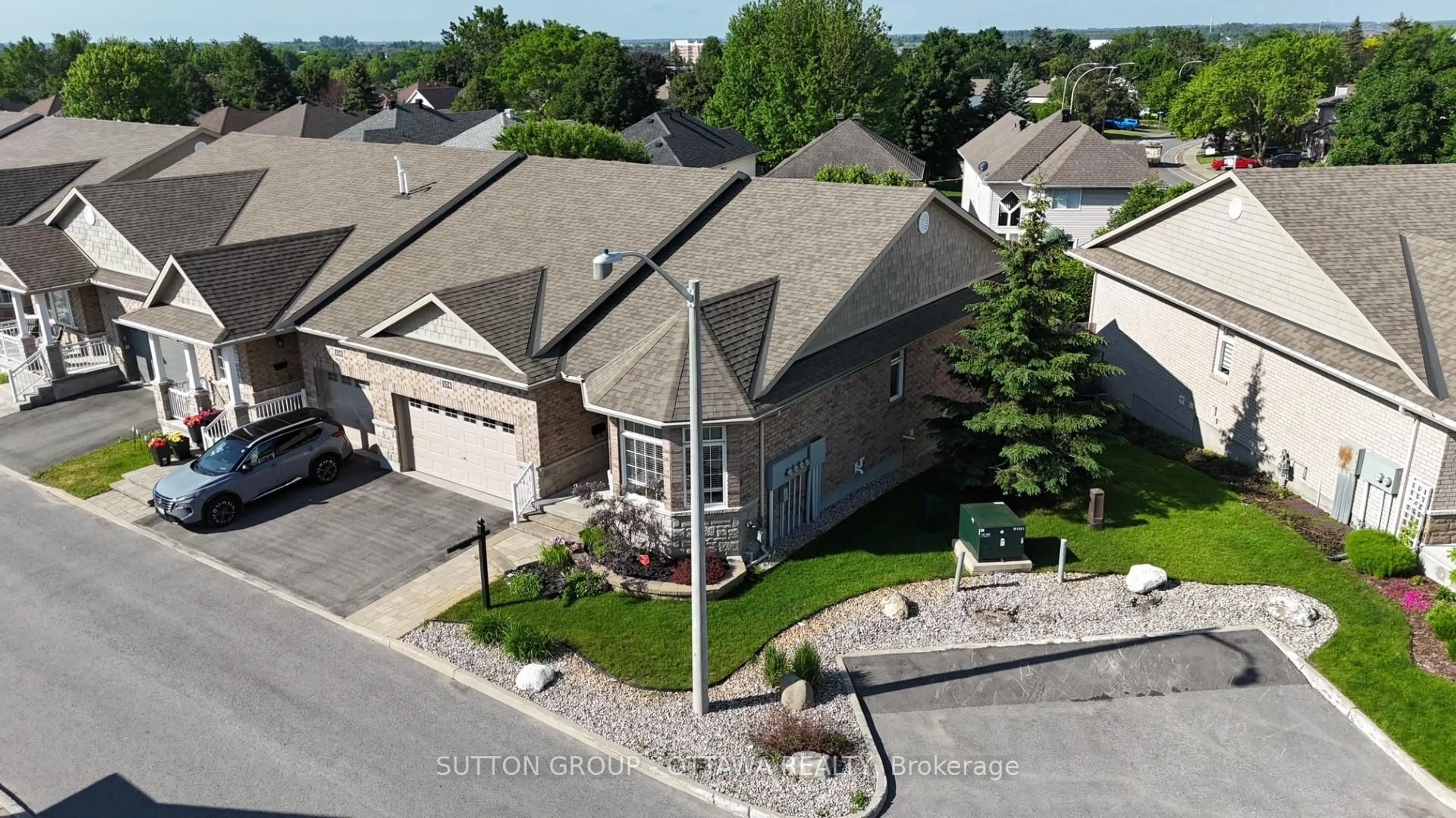 A pic from outside/outdoor area/front of a property/back of a property/a pic from drone, street for 104 Passageway Private, Kanata Ontario K2M 1H6
