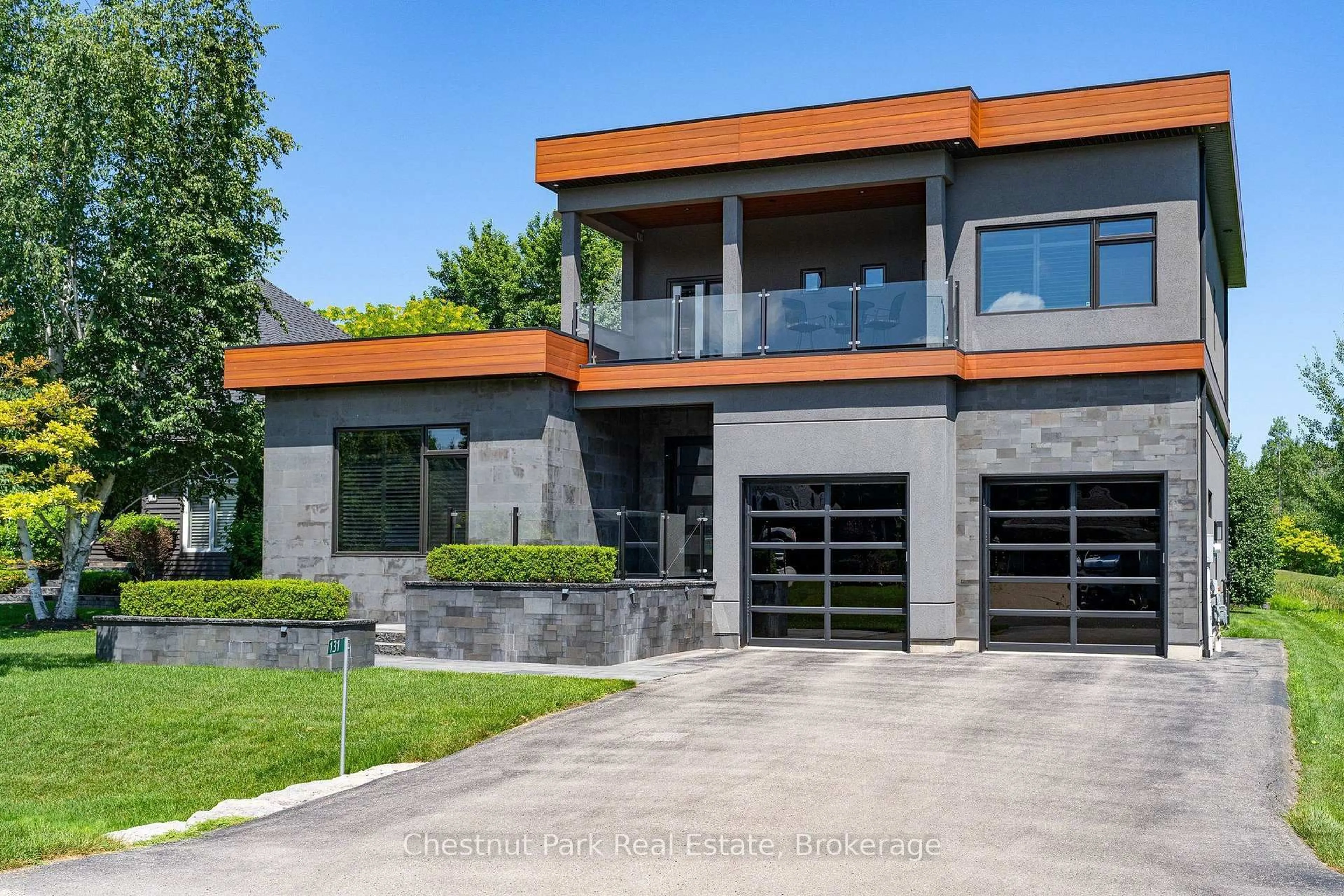 Home with brick exterior material, street for 131 Grand Cypress Lane, Blue Mountains Ontario L9Y 0K7